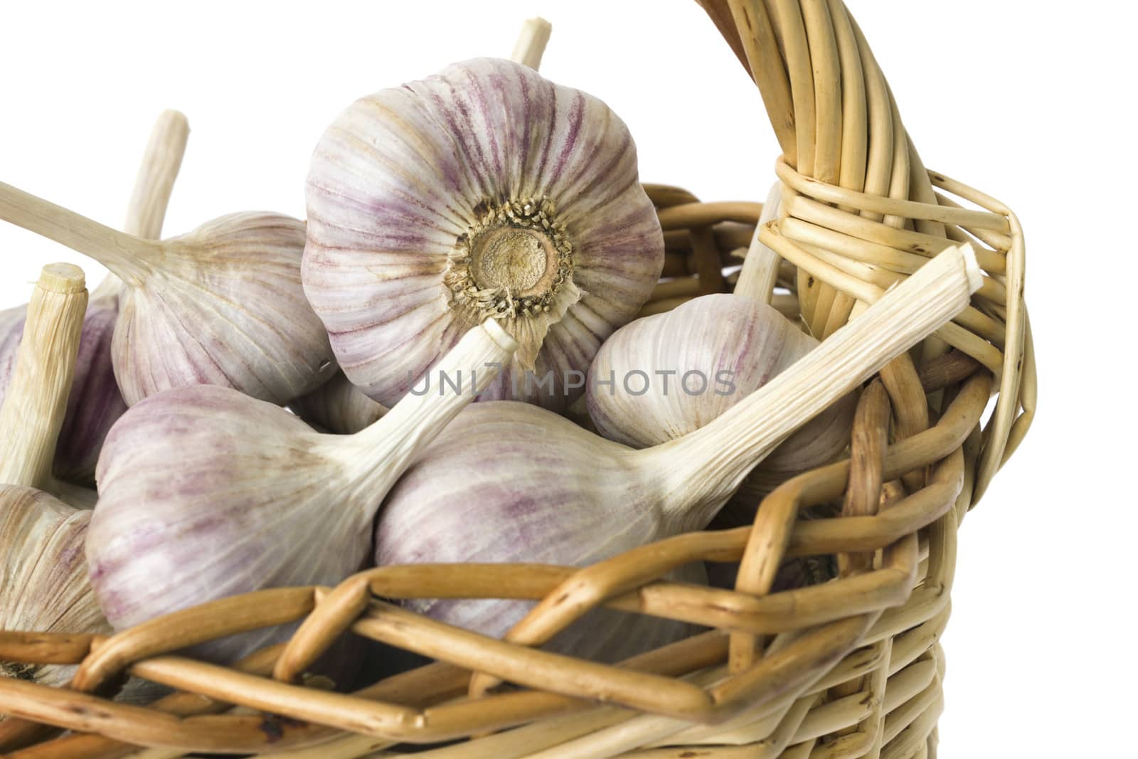 Large garlic bulbs in a wicker basket