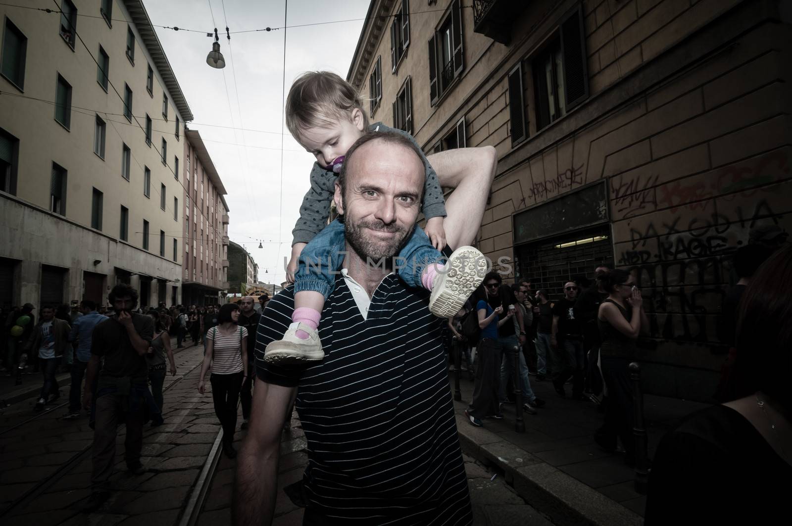 MILAN, ITALY - MAY 1: labor day held in Milan on May 1, 2013. Every year thousands of people taking to the streets to celebrate labor day and to protest against italian austerity