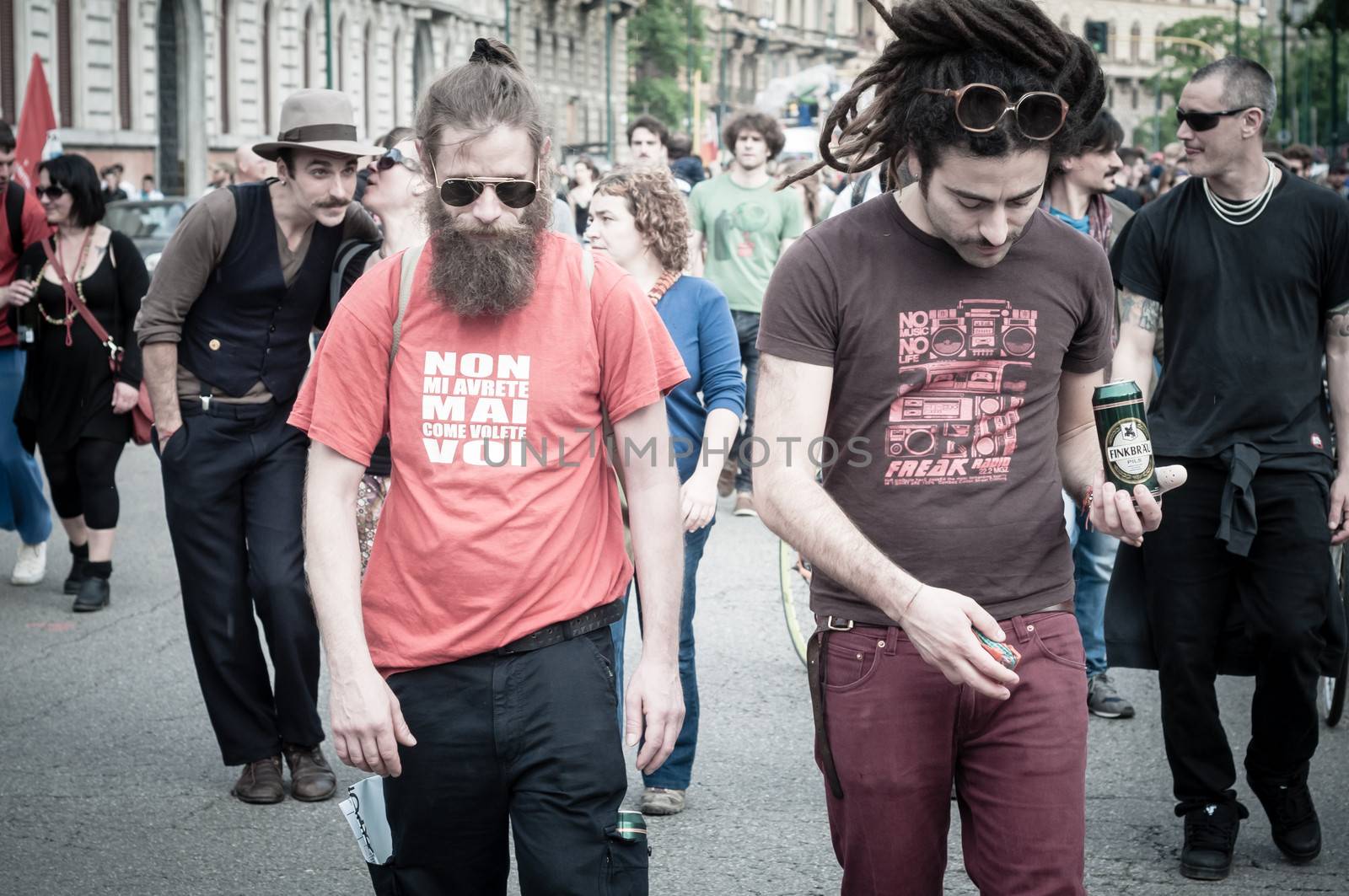 MILAN, ITALY - MAY 1: labor day held in Milan on May 1, 2013. Every year thousands of people taking to the streets to celebrate labor day and to protest against italian austerity