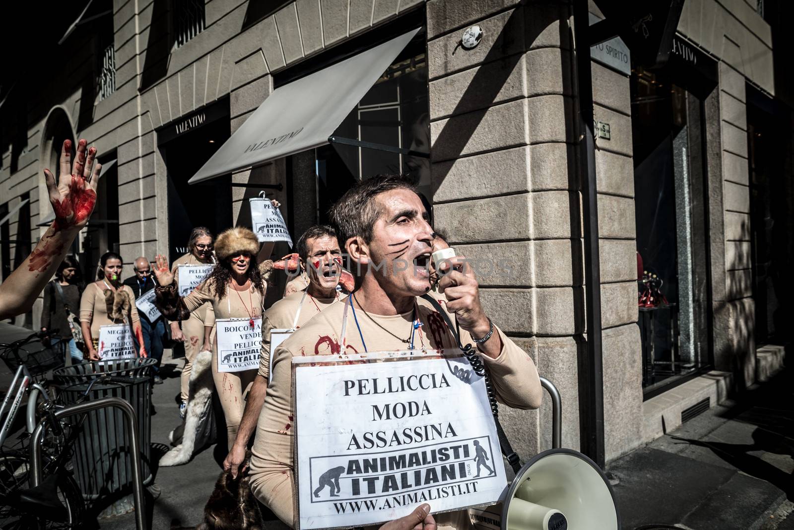 MILAN, ITALY - SEPTEMBER 17: Animalisti Italiani protest on September 17, 2013. Animal right association 'Animalisti Italiani' protest against furs and fashion, in famous fashion Milan street Monte Napoleone