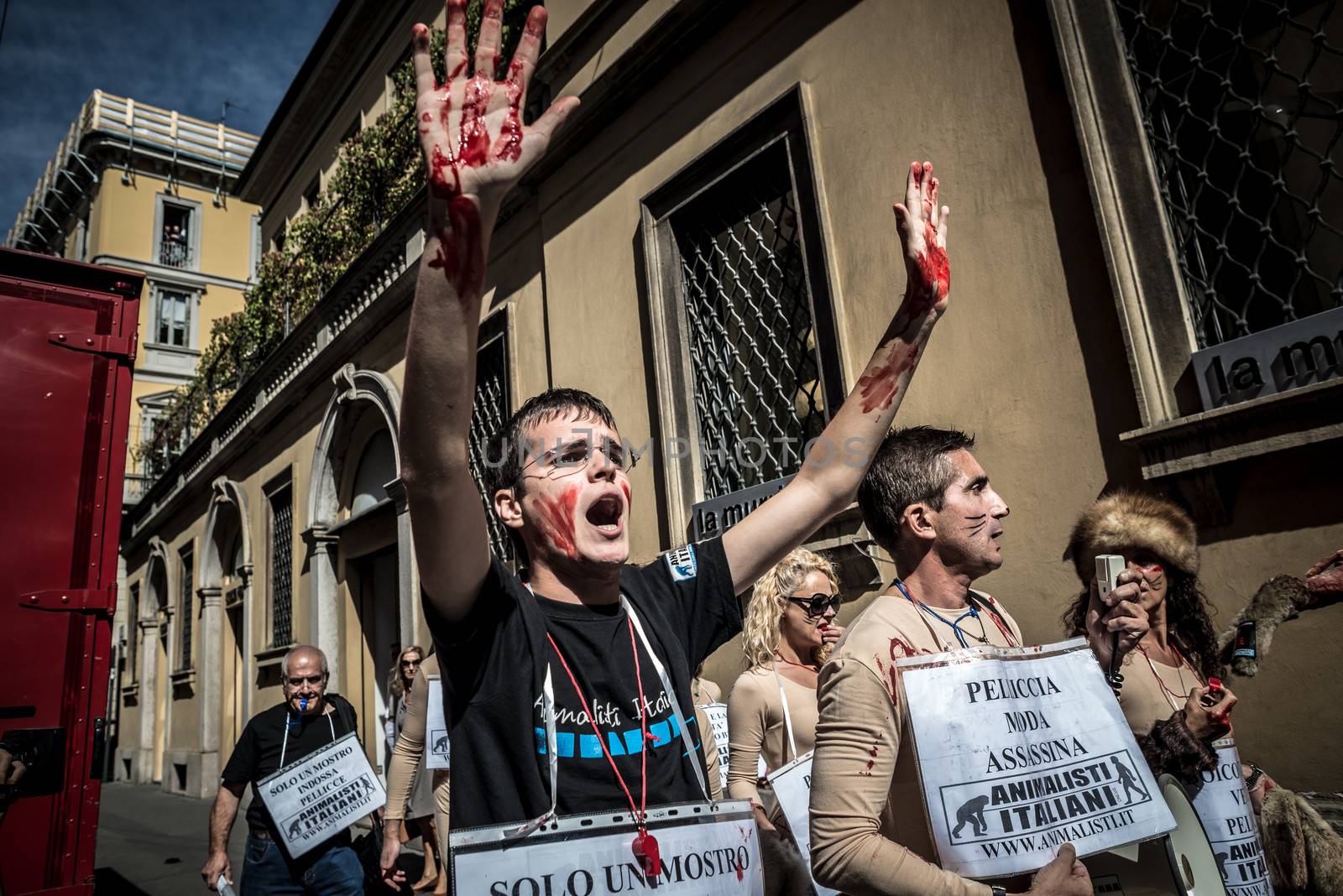 MILAN, ITALY - SEPTEMBER 17: Animalisti Italiani protest on September 17, 2013. Animal right association 'Animalisti Italiani' protest against furs and fashion, in famous fashion Milan street Monte Napoleone