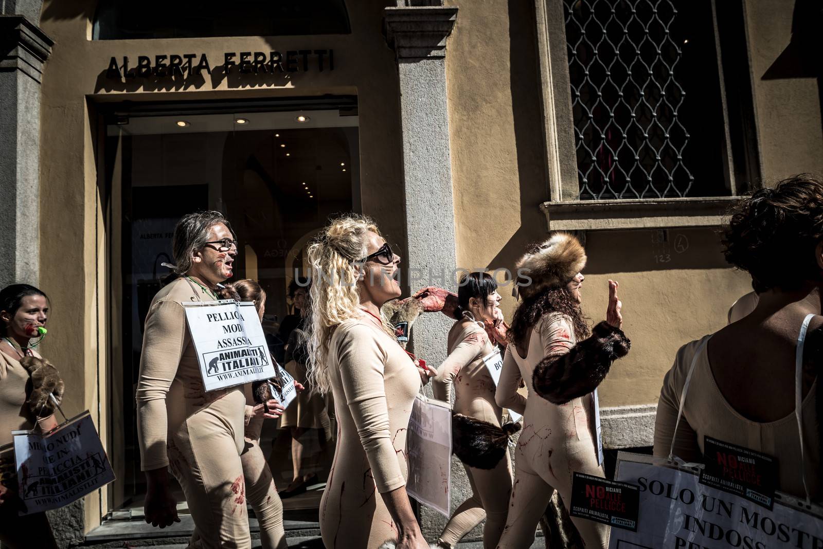 MILAN, ITALY - SEPTEMBER 17: Animalisti Italiani protest on September 17, 2013. Animal right association 'Animalisti Italiani' protest against furs and fashion, in famous fashion Milan street Monte Napoleone