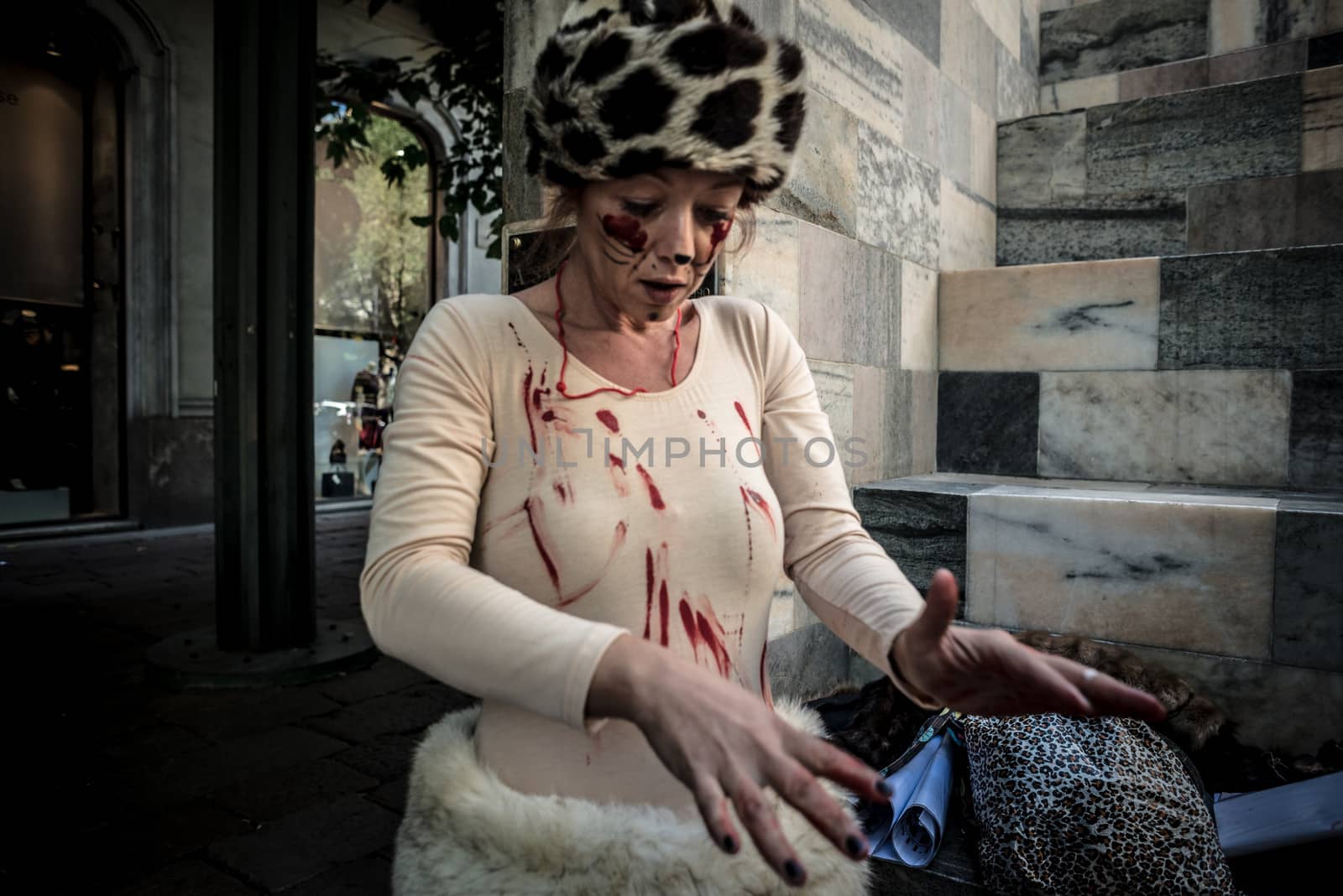 MILAN, ITALY - SEPTEMBER 17: Animalisti Italiani protest on September 17, 2013. Animal right association 'Animalisti Italiani' protest against furs and fashion, in famous fashion Milan street Monte Napoleone