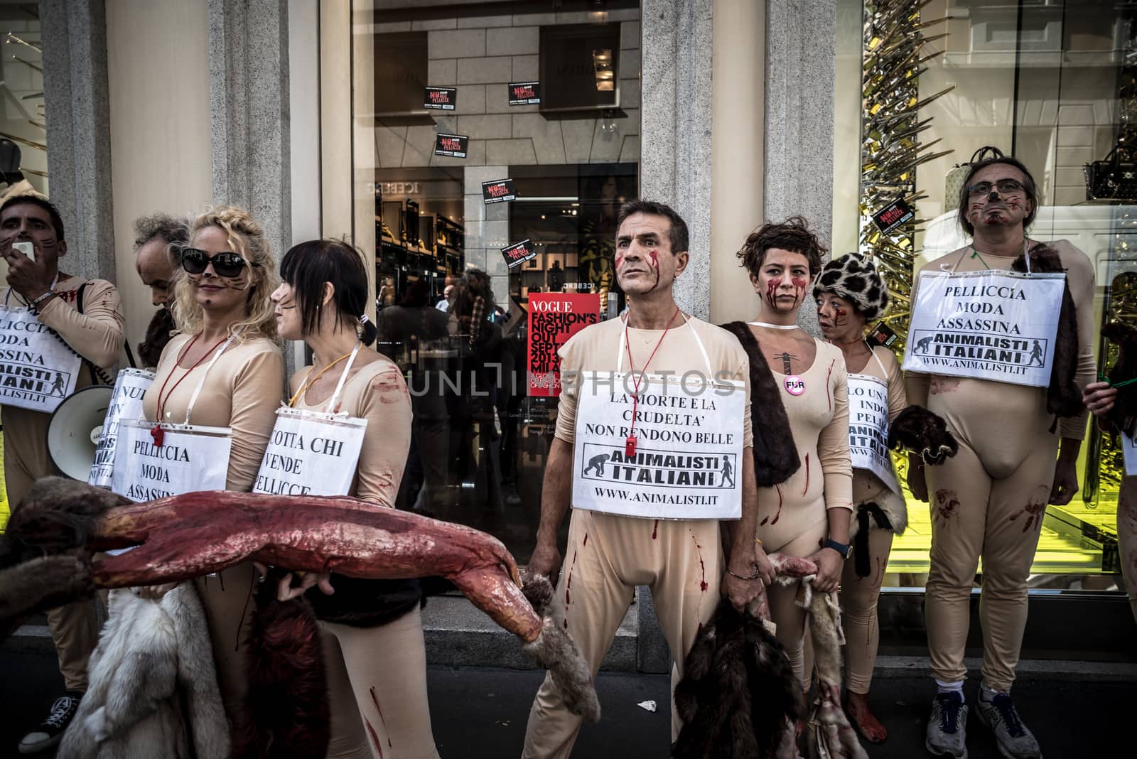 MILAN, ITALY - SEPTEMBER 17: Animalisti Italiani protest on September 17, 2013. Animal right association 'Animalisti Italiani' protest against furs and fashion, in famous fashion Milan street Monte Napoleone