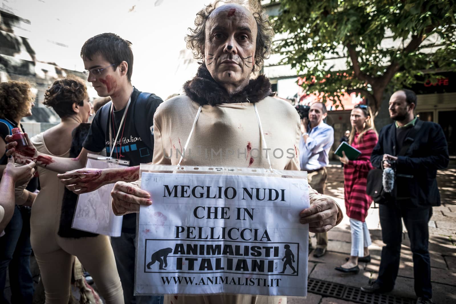 MILAN, ITALY - SEPTEMBER 17: Animalisti Italiani protest on September 17, 2013. Animal right association 'Animalisti Italiani' protest against furs and fashion, in famous fashion Milan street Monte Napoleone