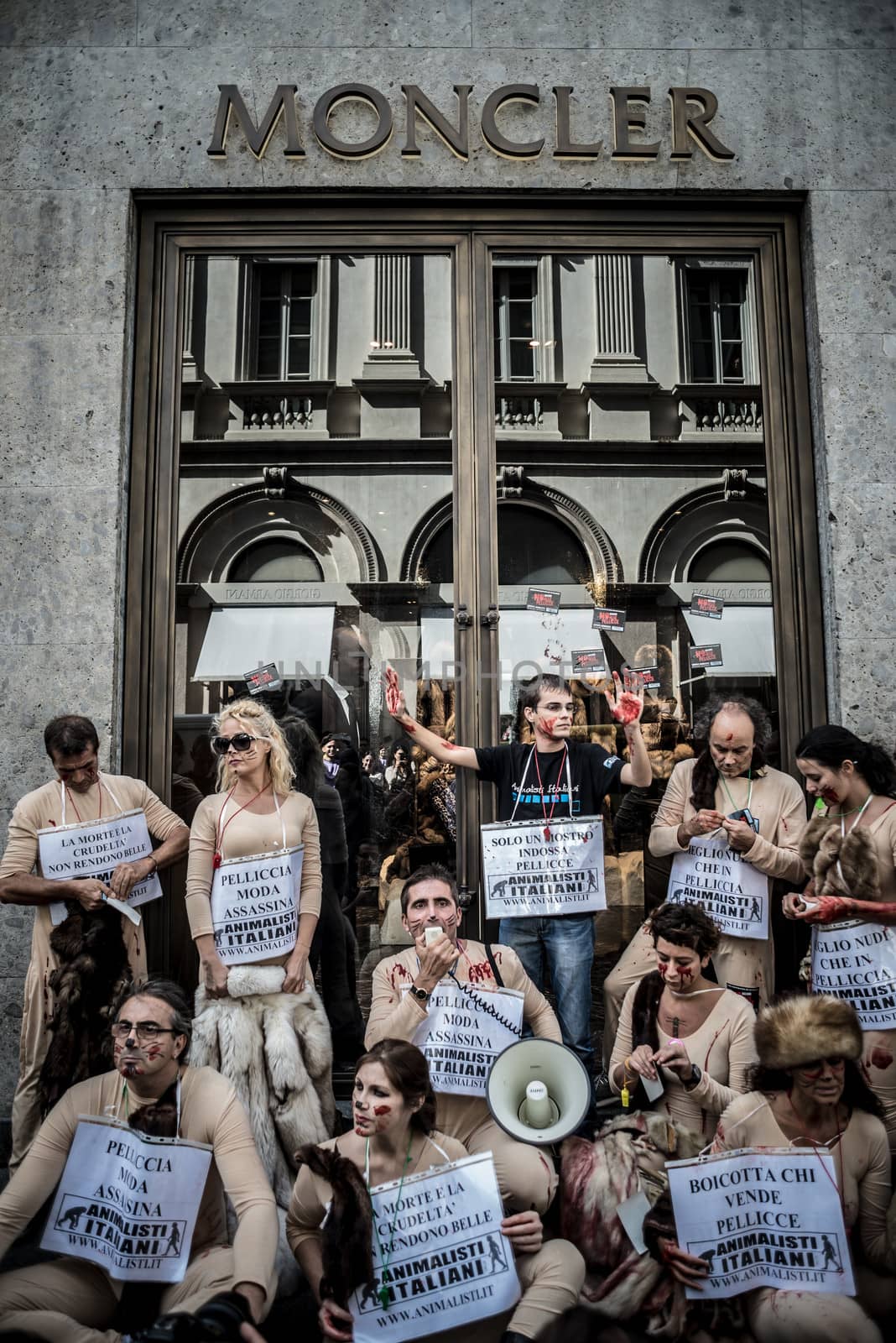 MILAN, ITALY - SEPTEMBER 17: Animalisti Italiani protest on September 17, 2013. Animal right association 'Animalisti Italiani' protest against furs and fashion, in famous fashion Milan street Monte Napoleone