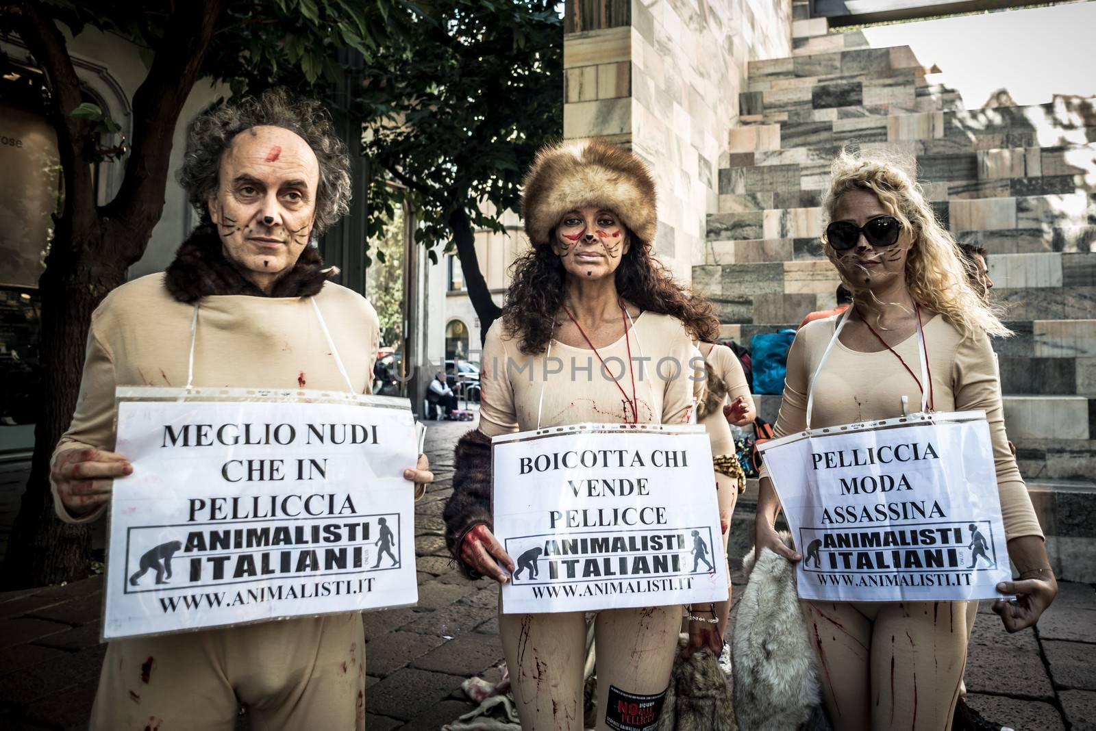 MILAN, ITALY - SEPTEMBER 17: Animalisti Italiani protest on September 17, 2013. Animal right association 'Animalisti Italiani' protest against furs and fashion, in famous fashion Milan street Monte Napoleone