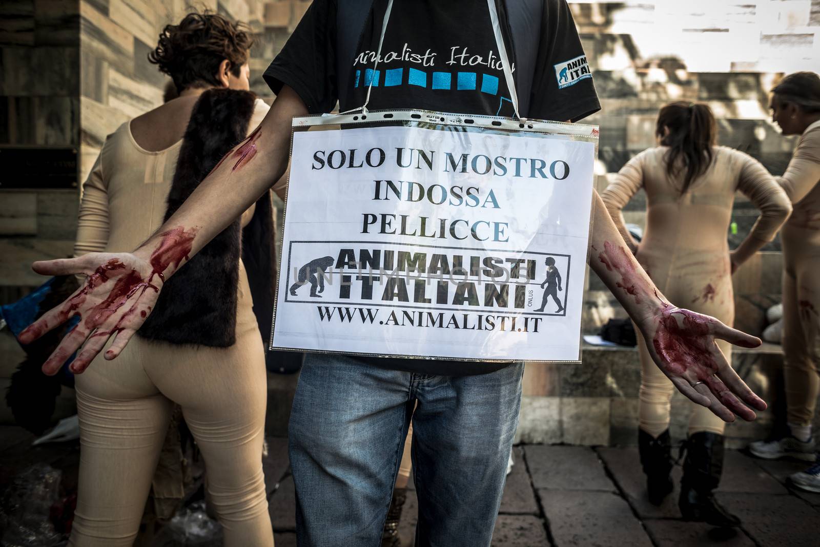 MILAN, ITALY - SEPTEMBER 17: Animalisti Italiani protest on September 17, 2013. Animal right association 'Animalisti Italiani' protest against furs and fashion, in famous fashion Milan street Monte Napoleone