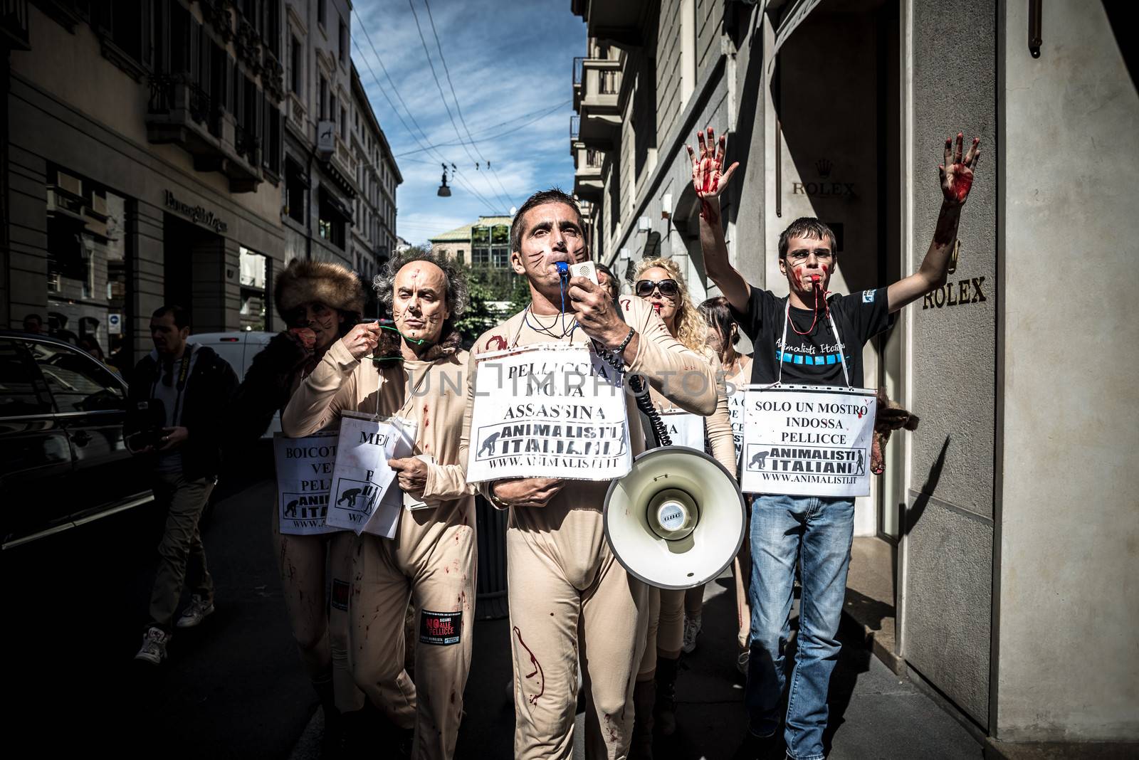 MILAN, ITALY - SEPTEMBER 17: Animalisti Italiani protest on September 17, 2013. Animal right association 'Animalisti Italiani' protest against furs and fashion, in famous fashion Milan street Monte Napoleone