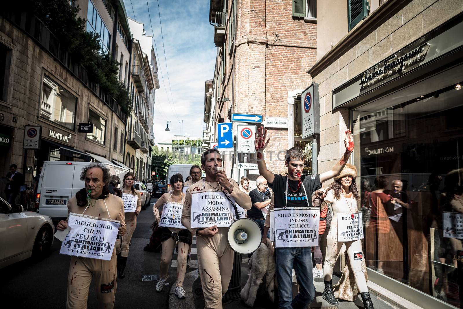 MILAN, ITALY - SEPTEMBER 17: Animalisti Italiani protest on September 17, 2013. Animal right association 'Animalisti Italiani' protest against furs and fashion, in famous fashion Milan street Monte Napoleone