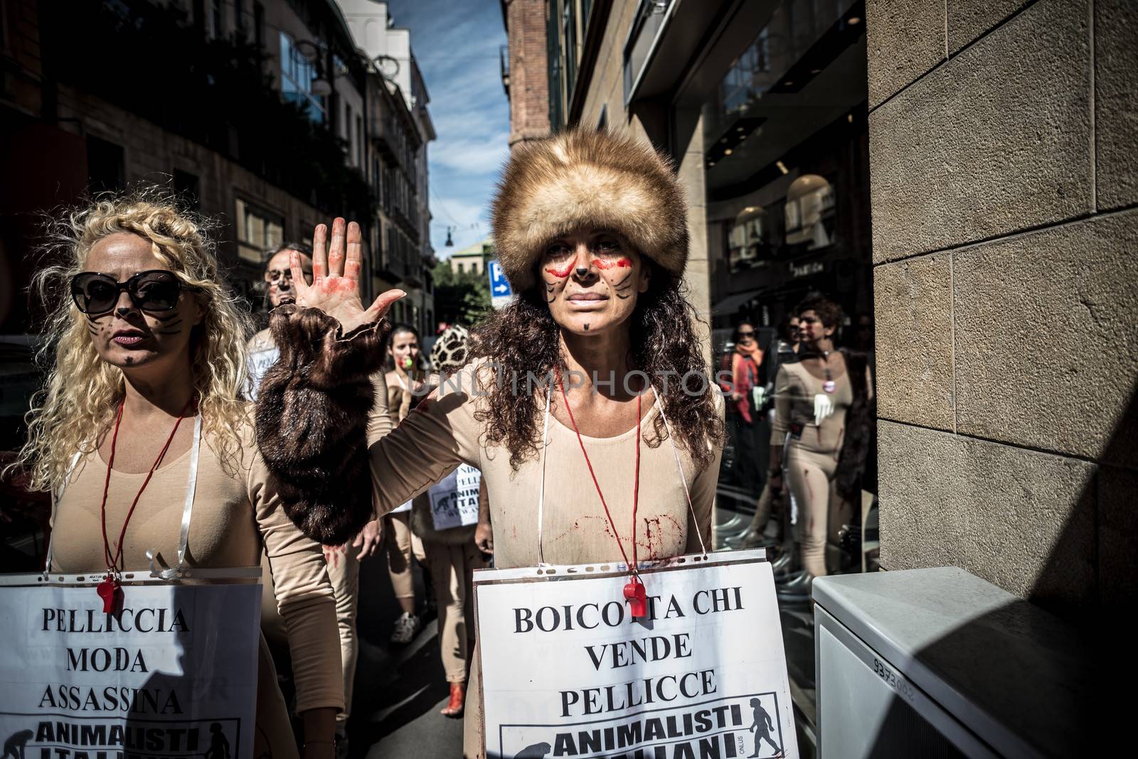 MILAN, ITALY - SEPTEMBER 17: Animalisti Italiani protest on September 17, 2013. Animal right association 'Animalisti Italiani' protest against furs and fashion, in famous fashion Milan street Monte Napoleone