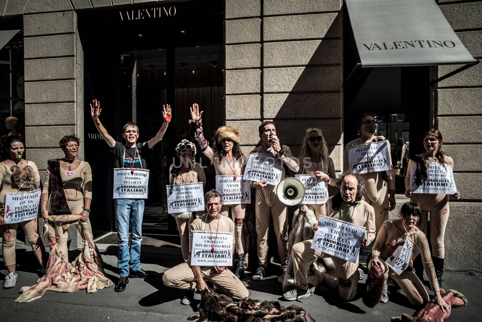 MILAN, ITALY - SEPTEMBER 17: Animalisti Italiani protest on September 17, 2013. Animal right association 'Animalisti Italiani' protest against furs and fashion, in famous fashion Milan street Monte Napoleone