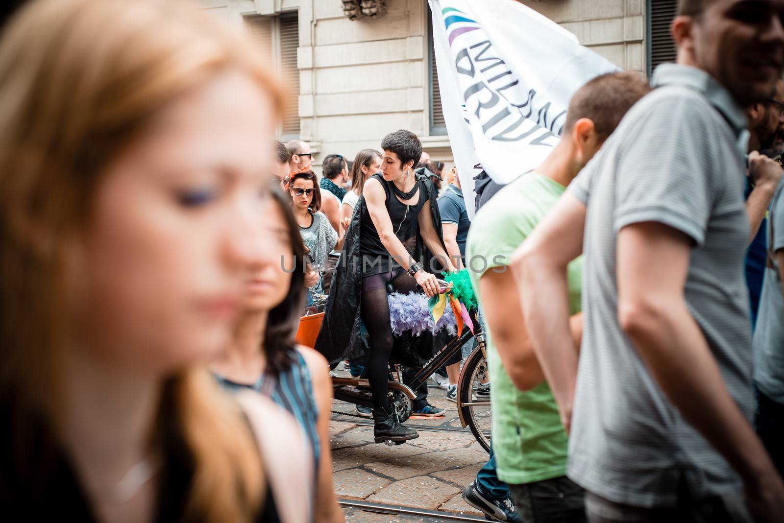 MILAN, ITALY - JUNE 29: gay pride manifestation in Milan June 29, 2013. Normal people, gay, lesbians, transgenders and bisexuals take to the street for their rights organizing a street parade party