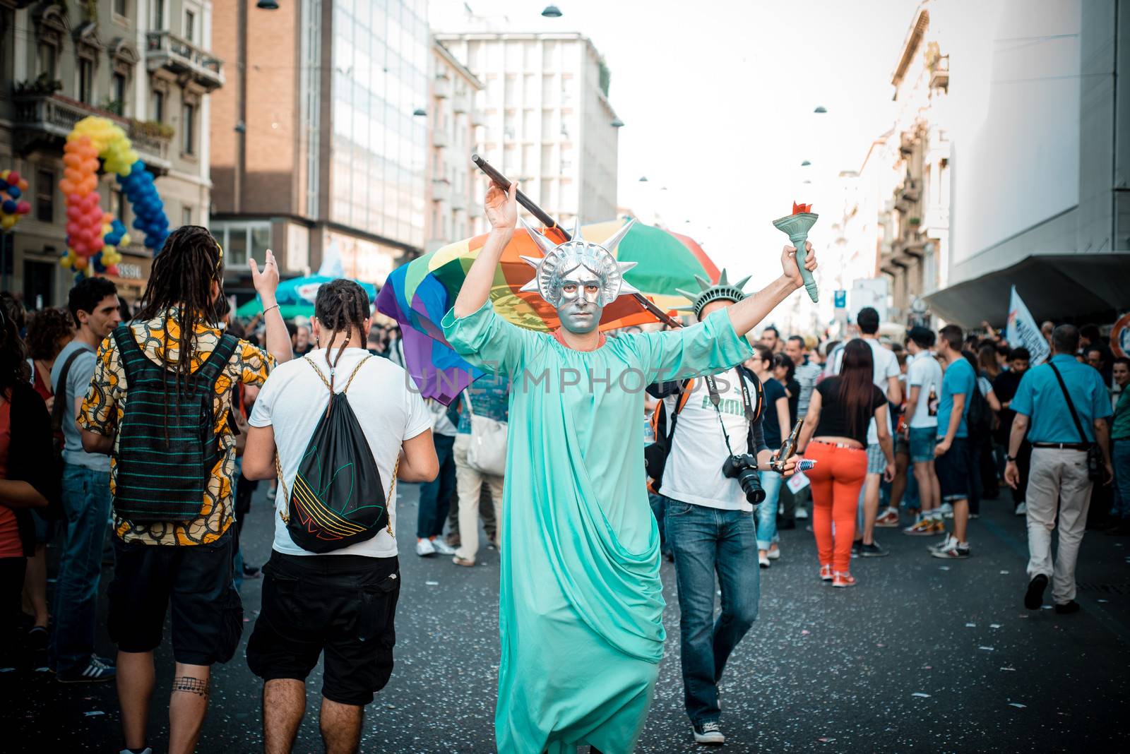 MILAN, ITALY - JUNE 29: gay pride manifestation in Milan June 29, 2013. Normal people, gay, lesbians, transgenders and bisexuals take to the street for their rights organizing a street parade party