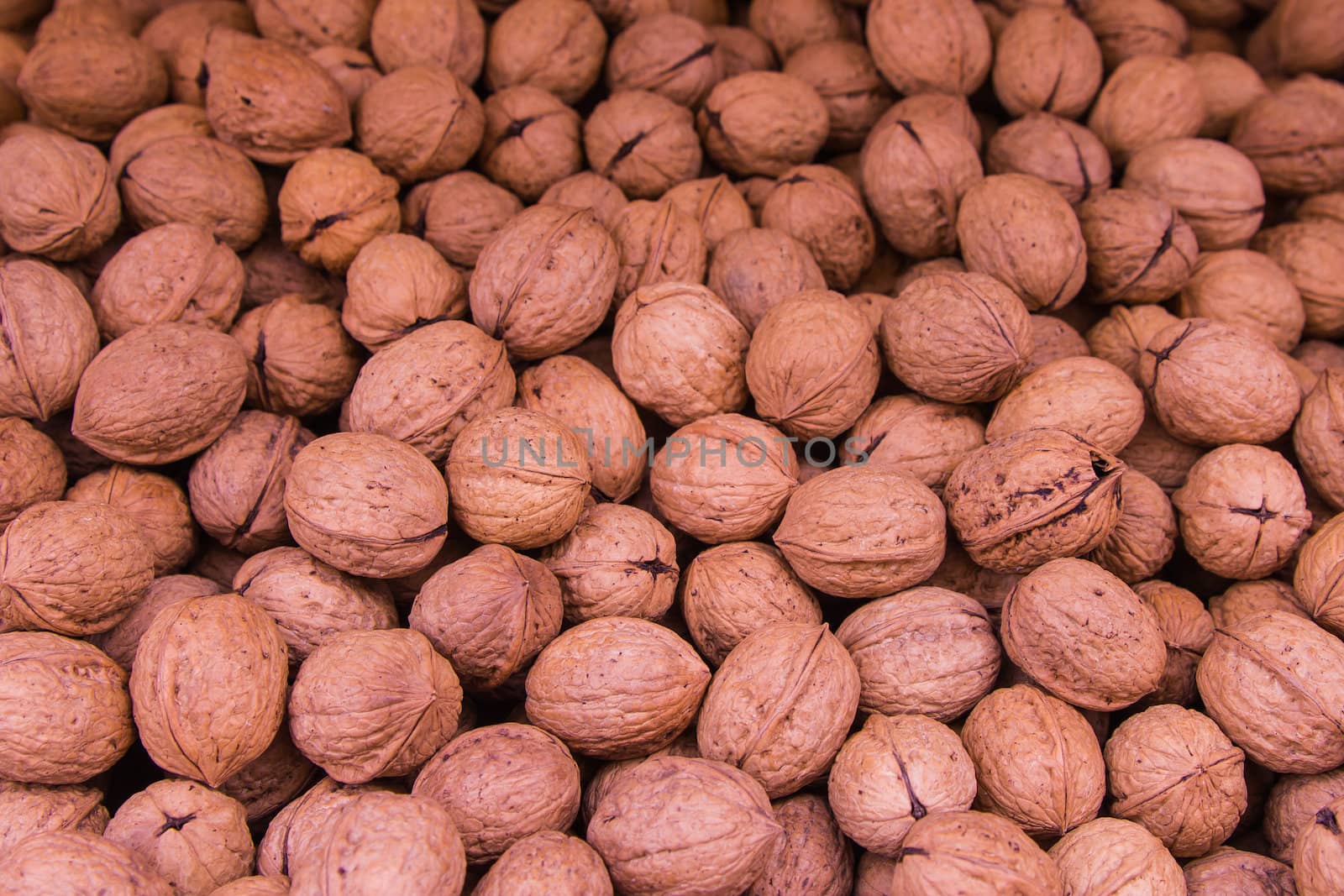 Ripe walnuts in shells background by huntz