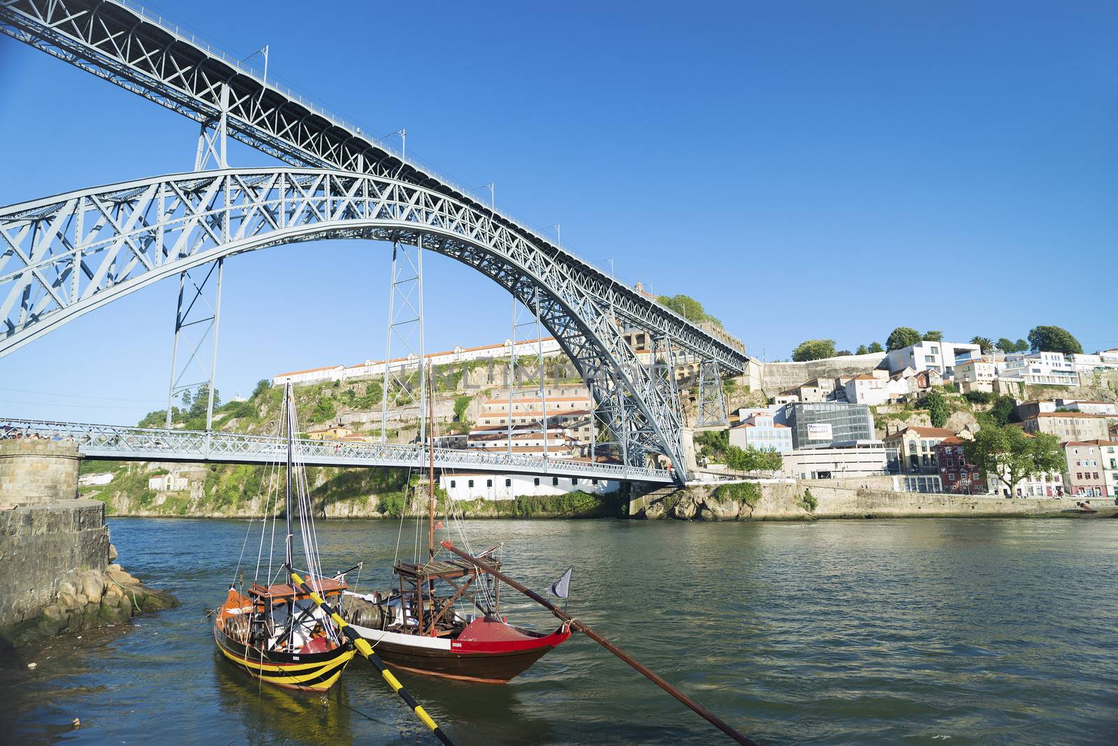 dom luis bridge and rabelo boats in porto portugal