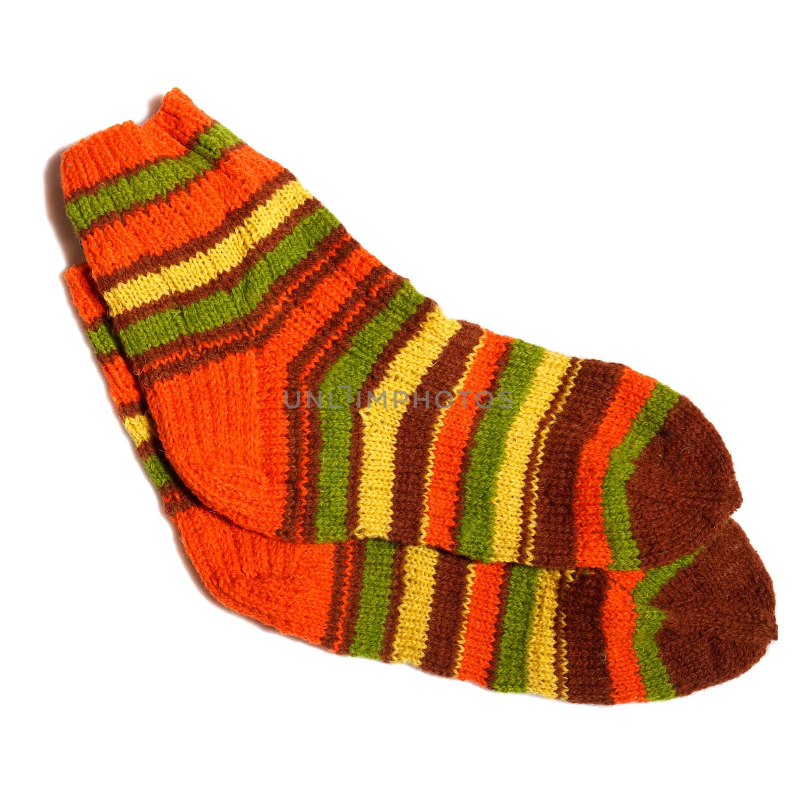 Hand knitted warm wool socks on a white background