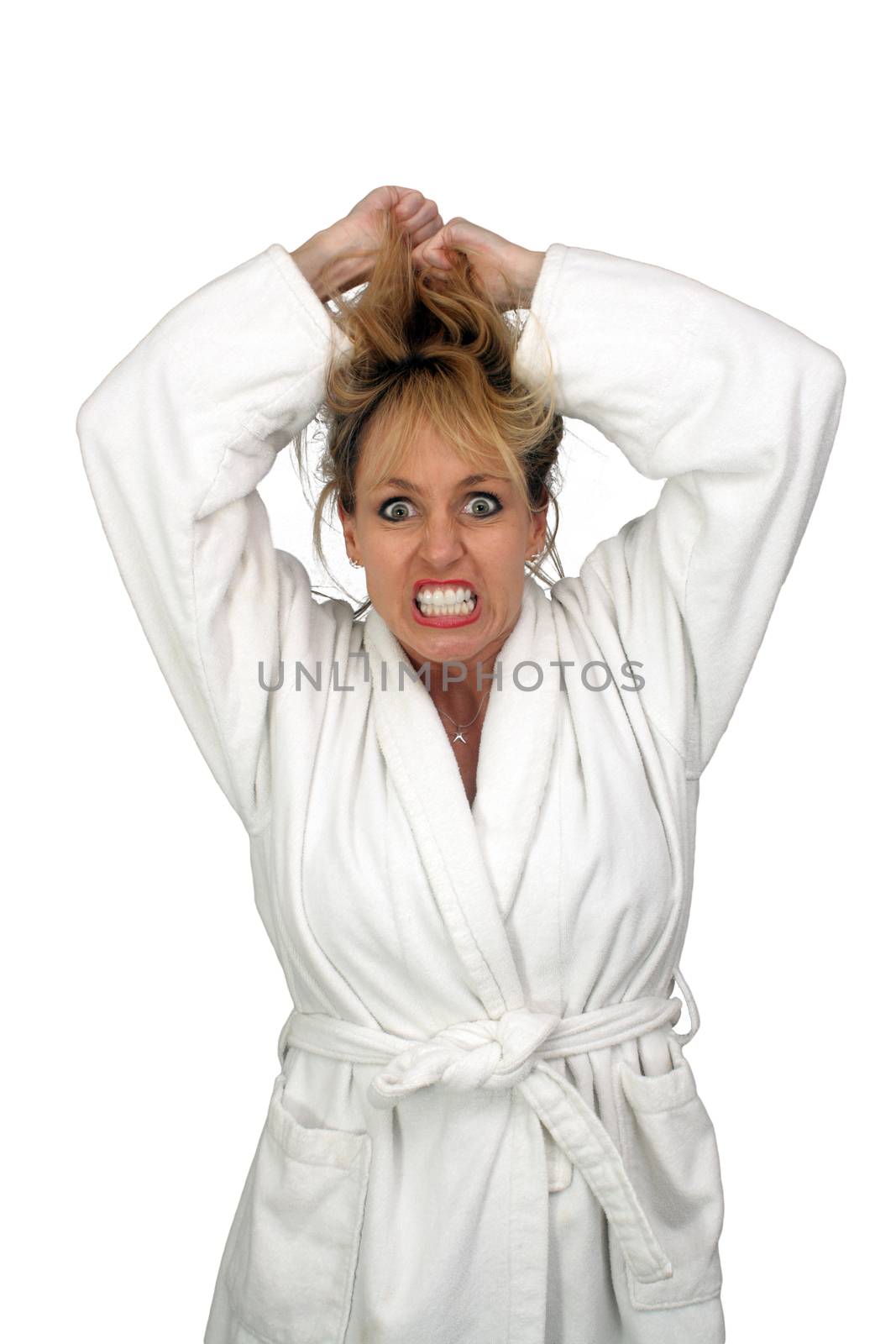 A lovely but insane, angry, or frustrated blonde, pulling her hair.  Isolated on a white background.