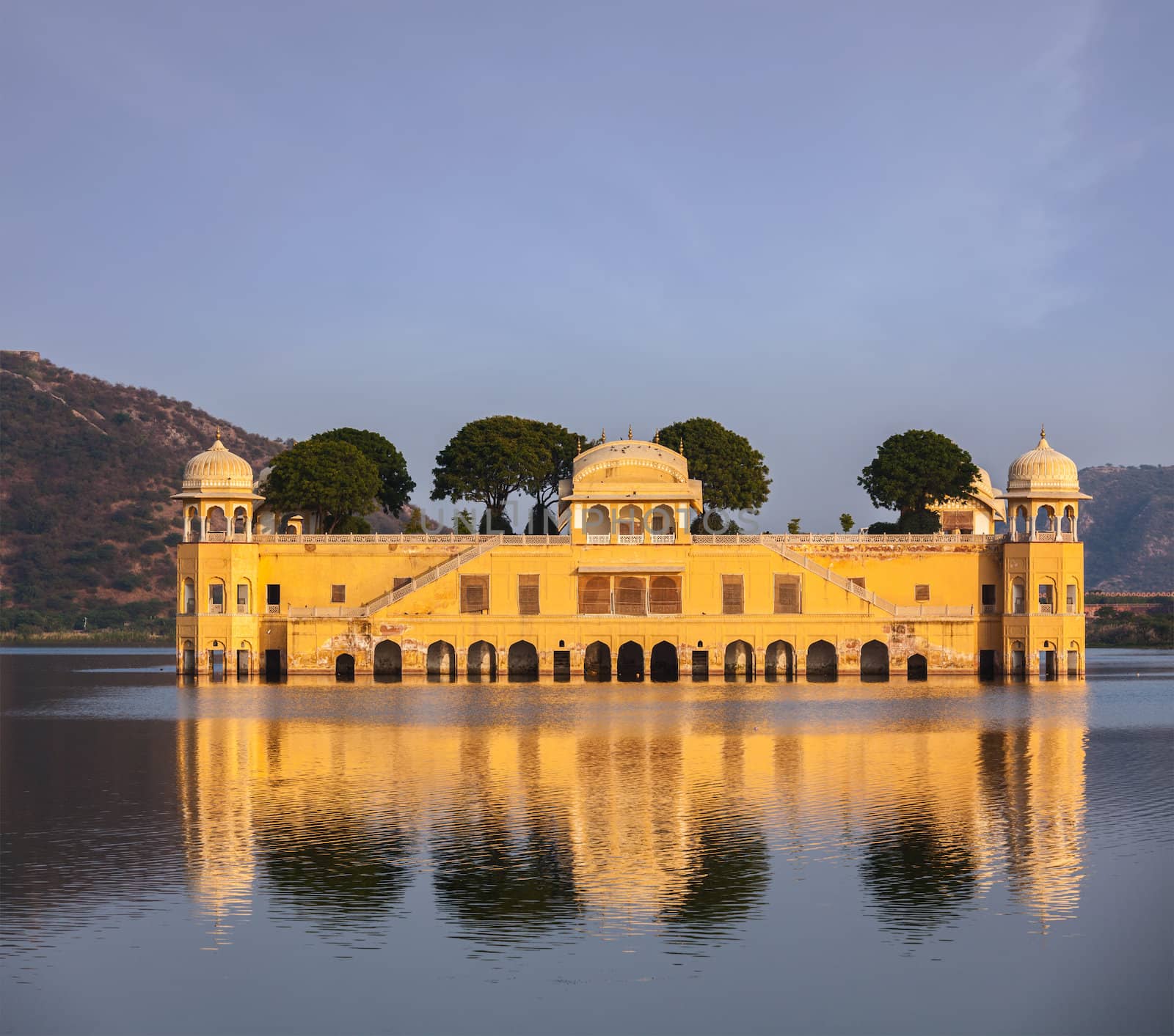 Rajasthan landmark - Jal Mahal (Water Palace) on Man Sagar Lake on sunset.  Jaipur, Rajasthan, India