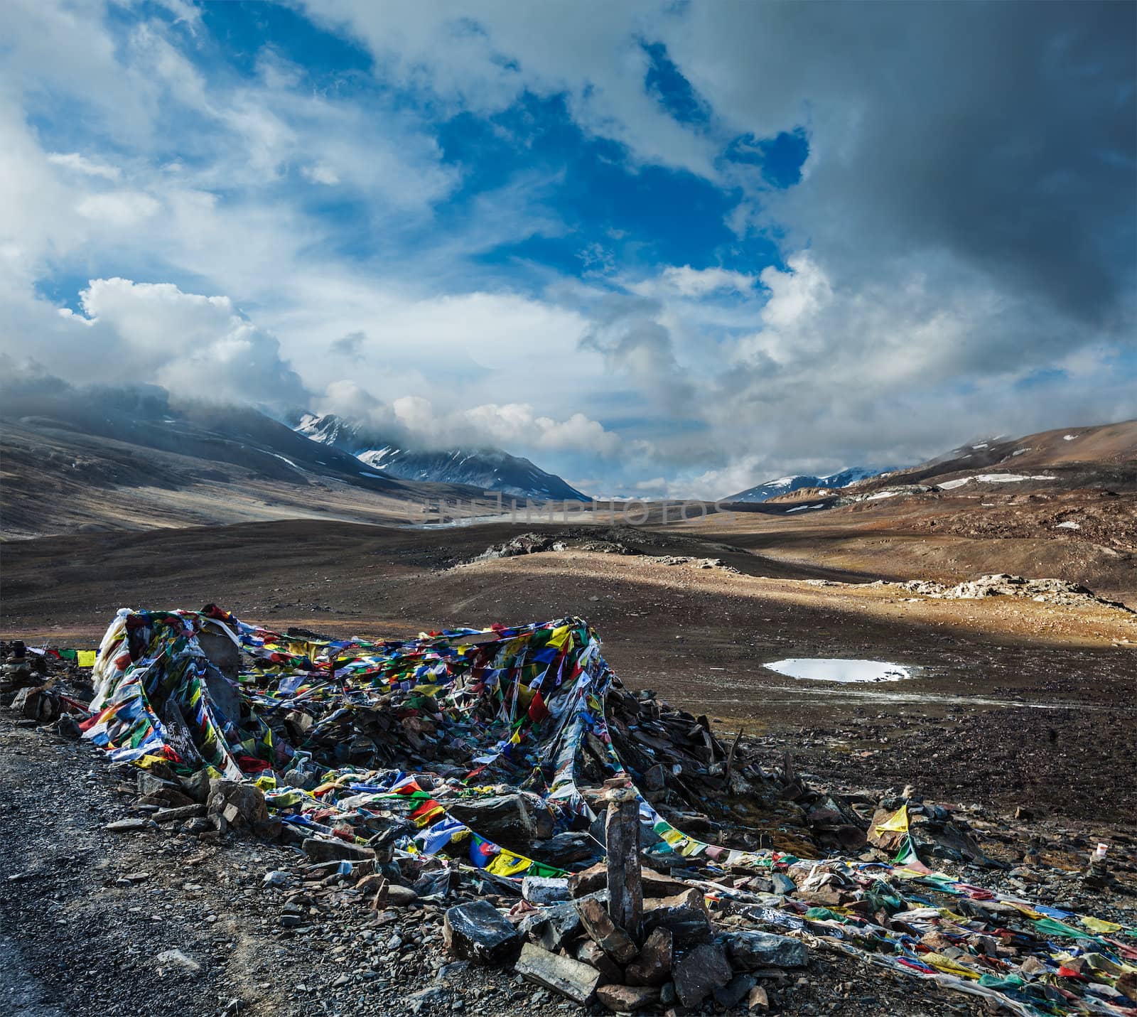 Buddhist prayer flags (lungta) on Baralacha La pass in Himalayas by dimol