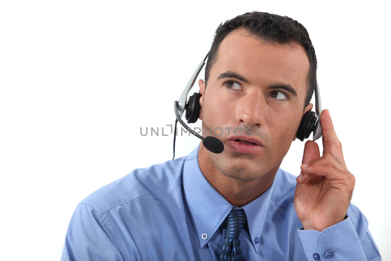 Man speaking into a hands-free headset by phovoir