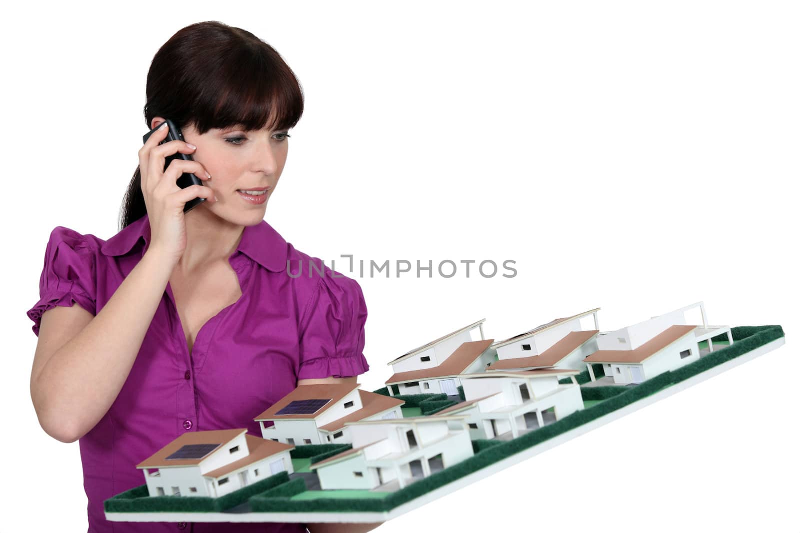 Businesswoman holding architectural model