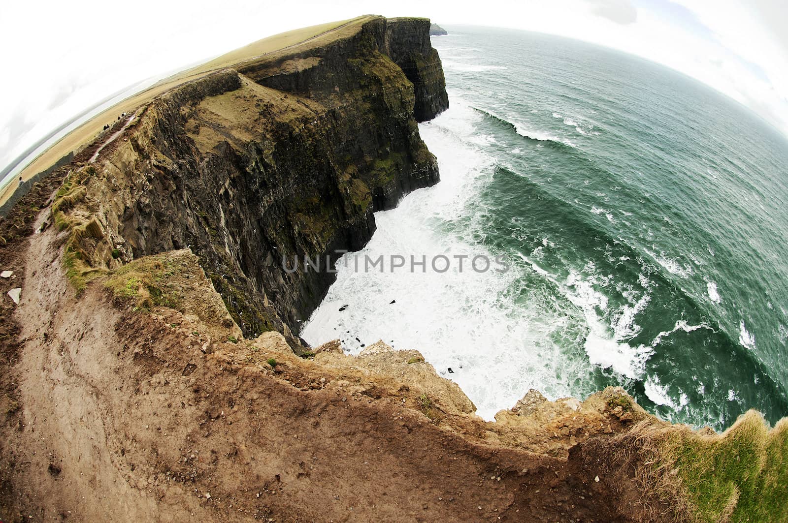 The Cliffs of Moher (Irish: Aillte an Mhothair) are located at the southwestern edge of the Burren region in County Clare, Ireland. They rise 120 metres (390 ft) above the Atlantic Ocean at Hag's Head, and reach their maximum height of 214 metres (702 ft) just north of O'Brien's Tower.