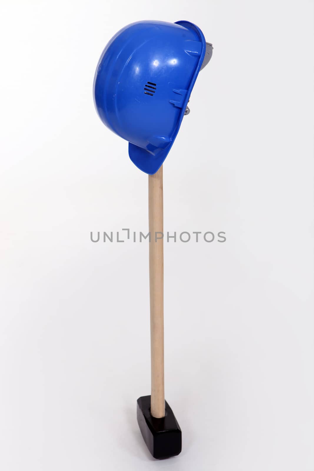 Hammer and blue helmet isolated on white background