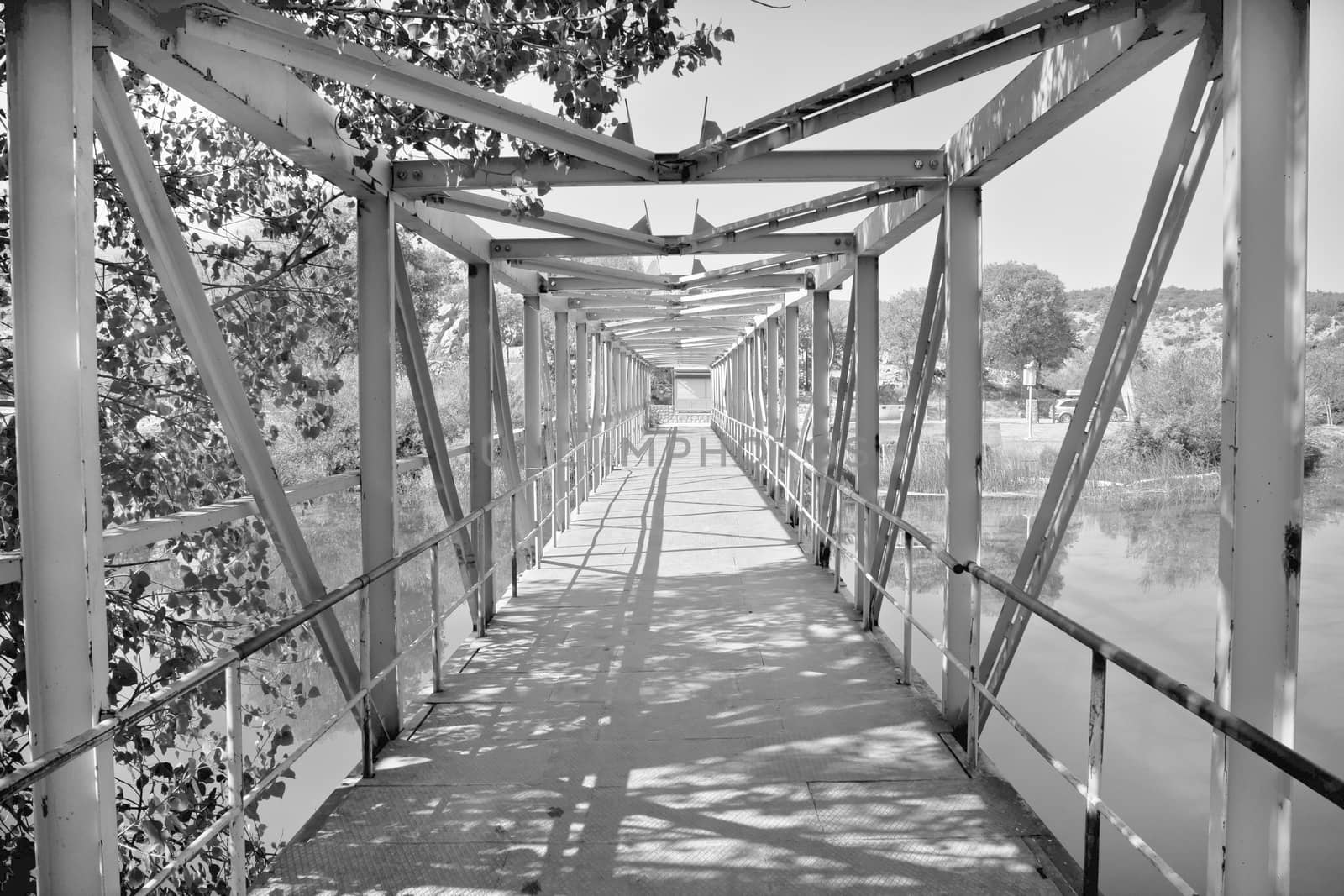 Old style iron river bridge black and white, River of Zrmanja, Croatia