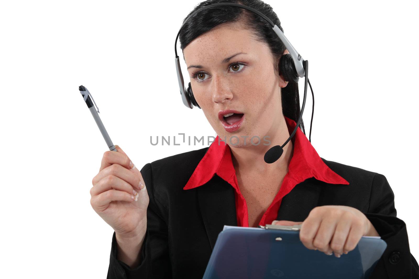 Woman with a headset and clipboard by phovoir