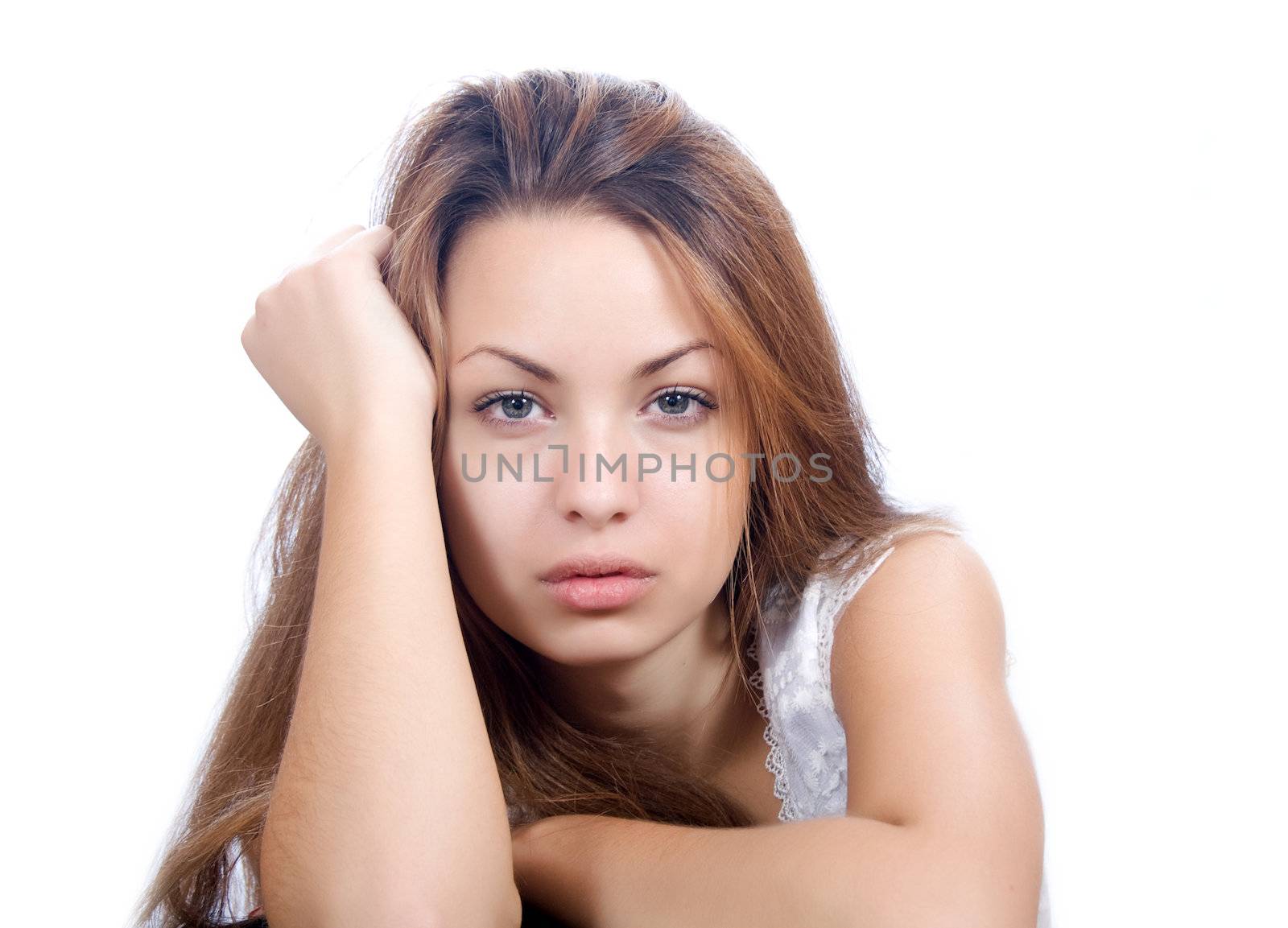 Portrait of a beautiful pensive woman isolated on white background