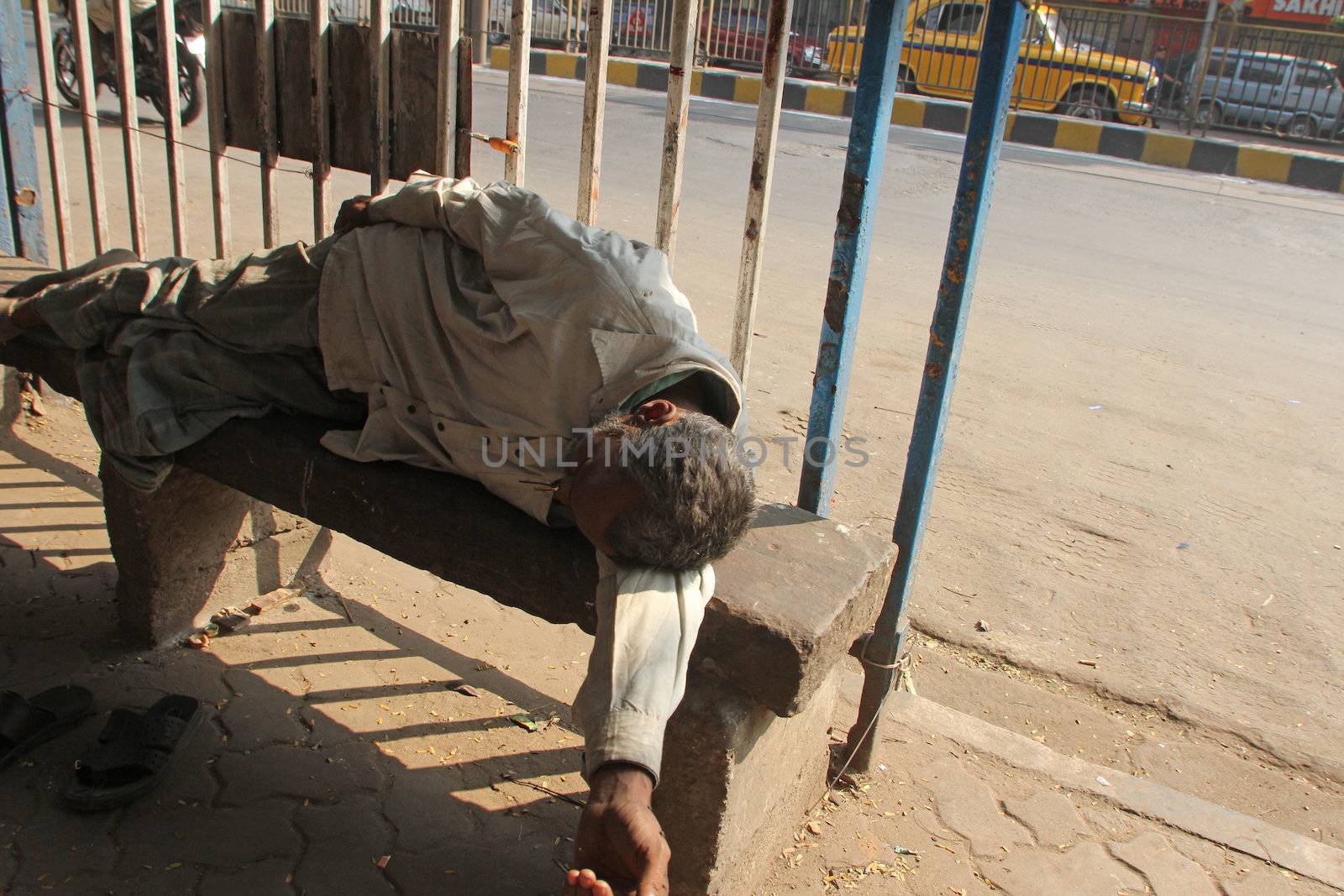 Homeless people sleeping on the footpath of Kolkata by atlas