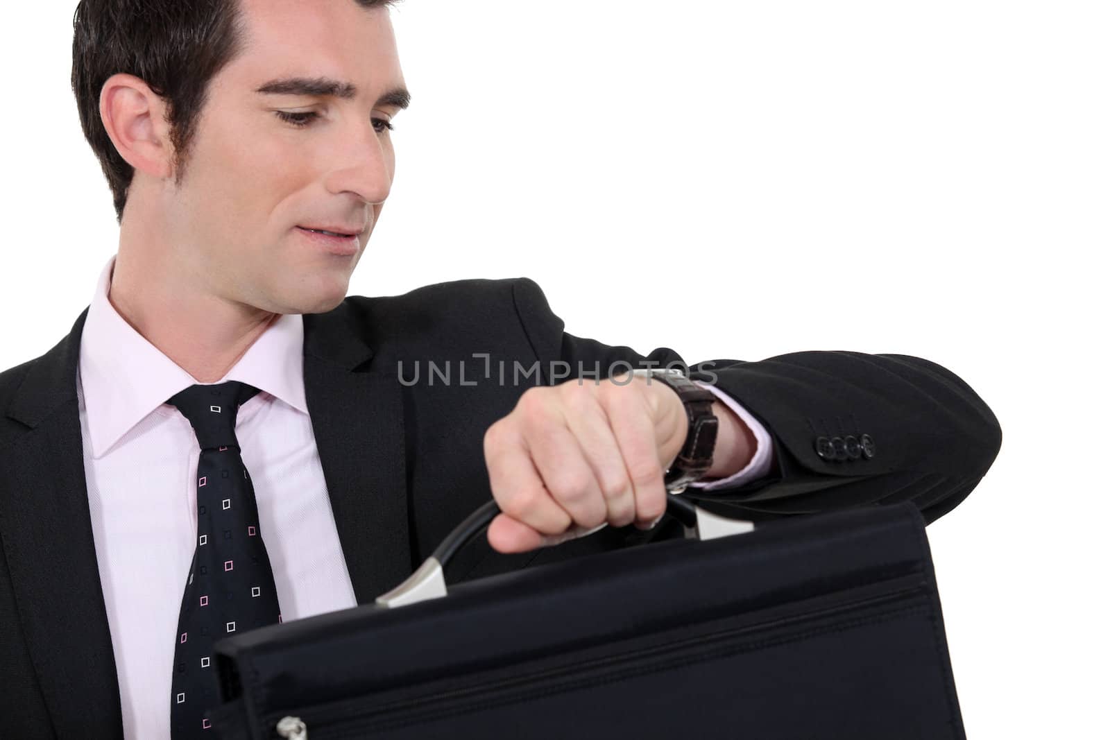Businessman checking he is not late