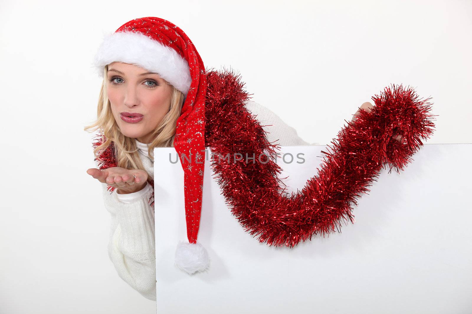 Woman celebrating Christmas by phovoir