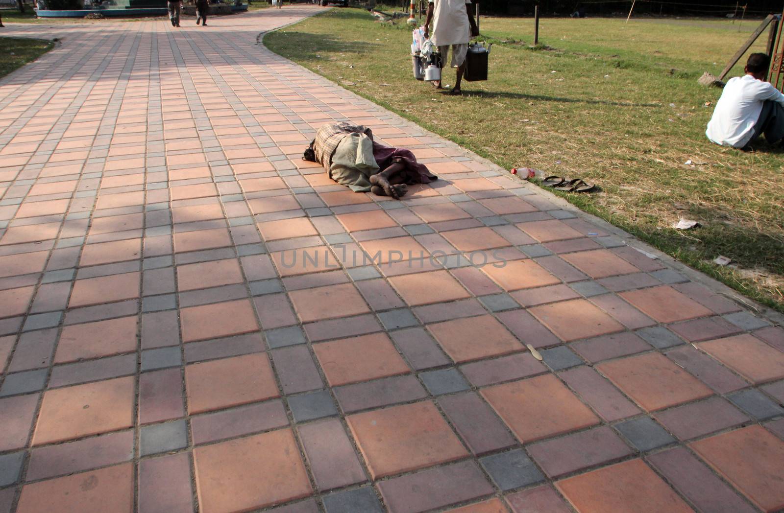 Homeless people sleeping on the footpath of Kolkata by atlas