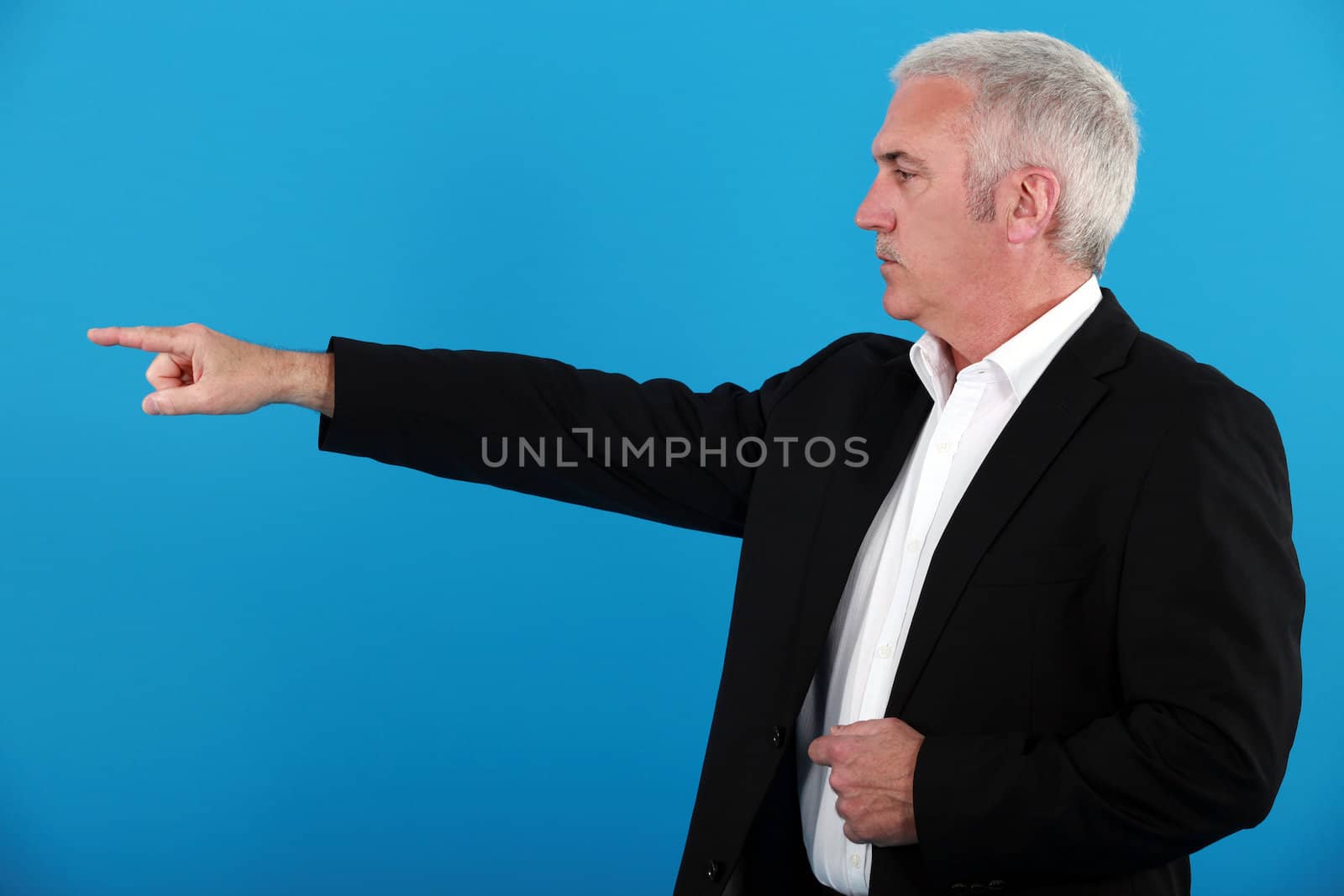 Businessman pointing his finger by phovoir