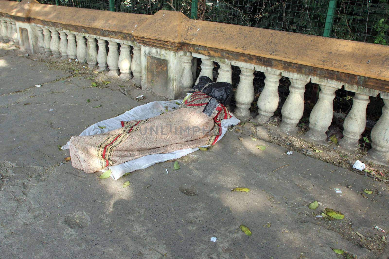 Homeless people sleeping on the footpath of Kolkata by atlas