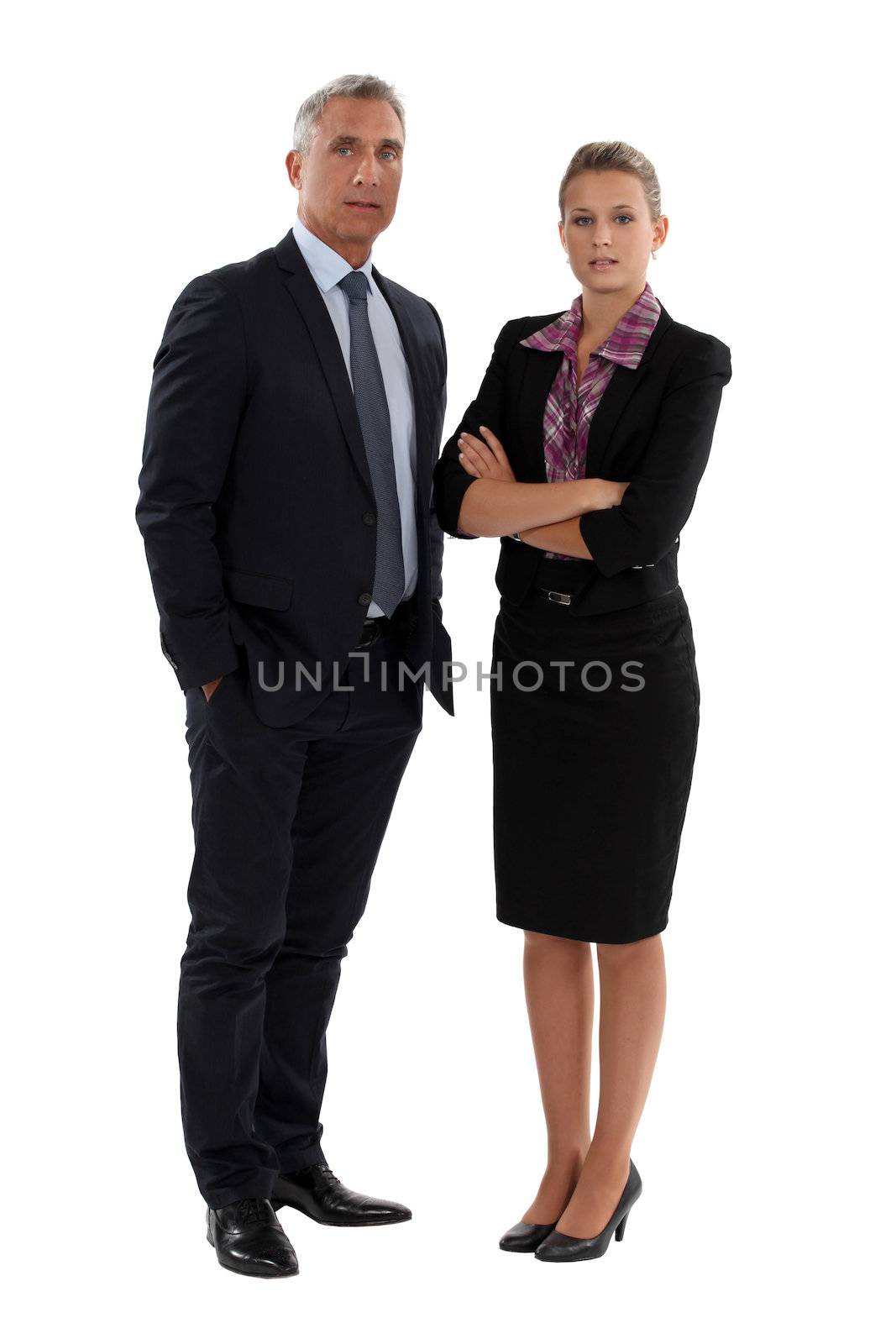 Senior businessman and young businesswoman by phovoir