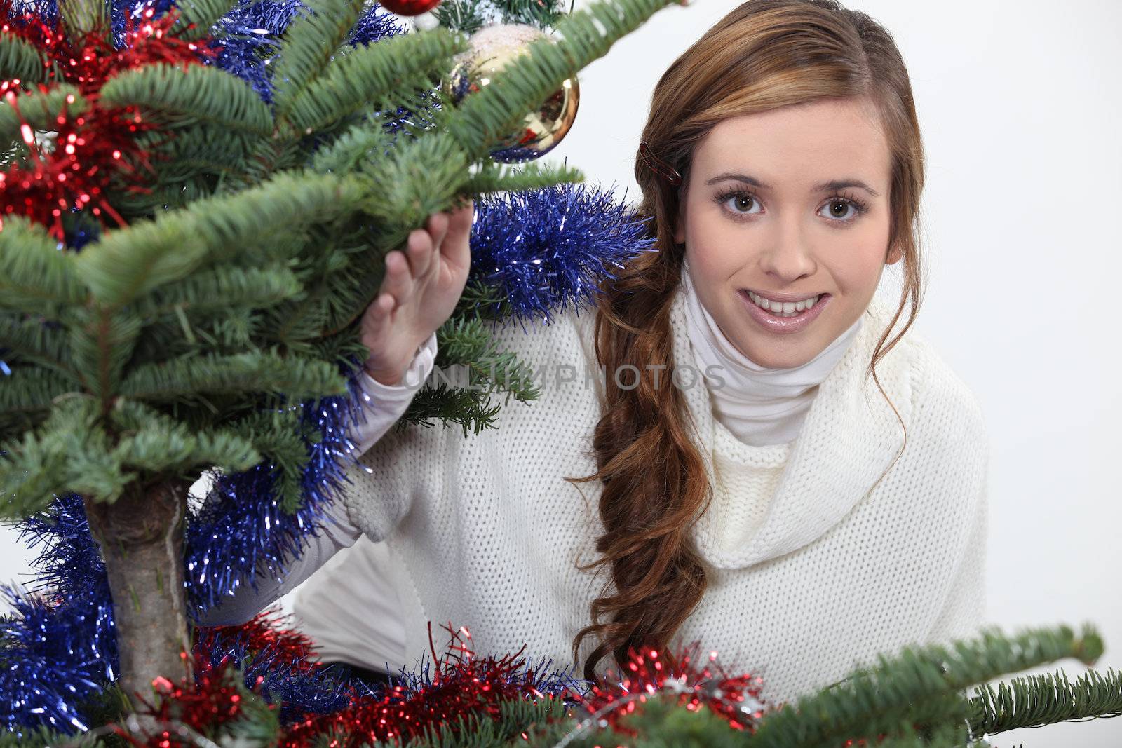 young woman celebrating Christmas by phovoir