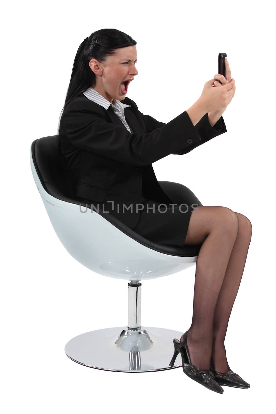 woman looking at her cell and screaming