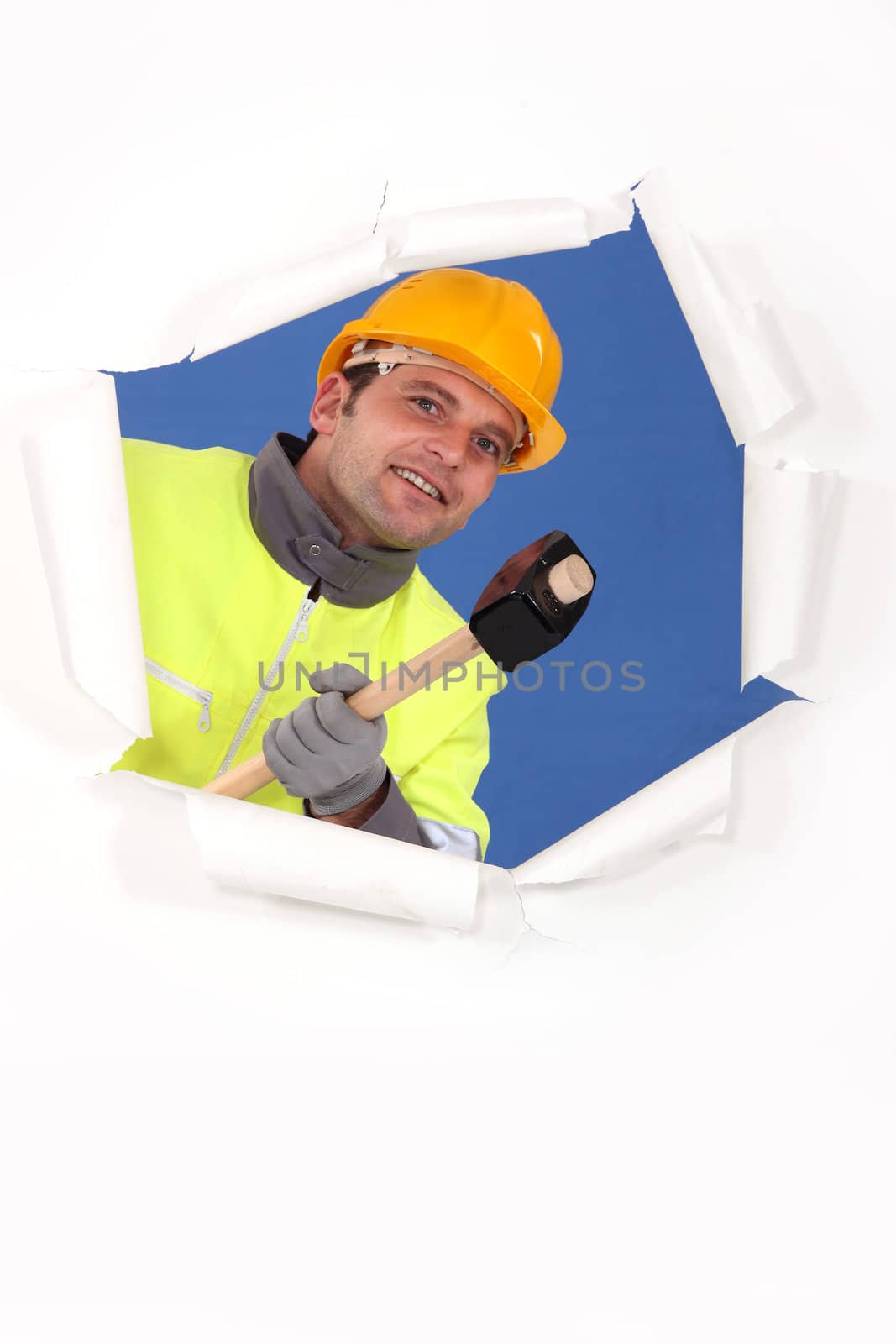 Construction worker with a mallet by phovoir