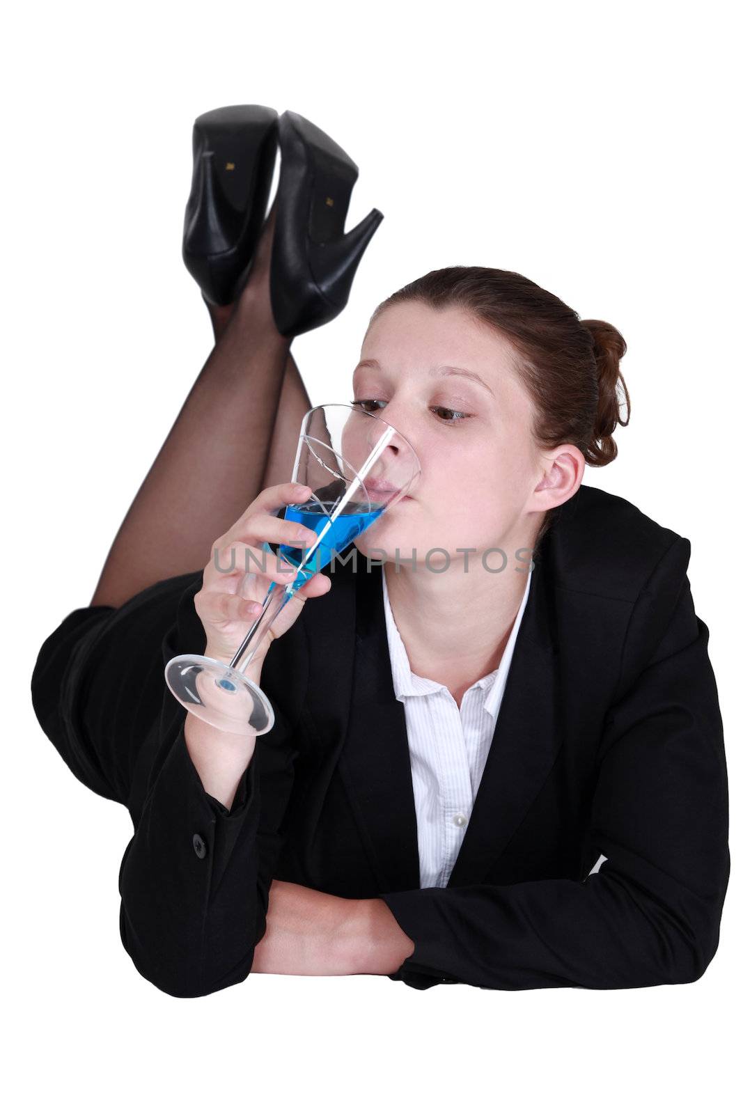 Businesswoman drinking a cocktail