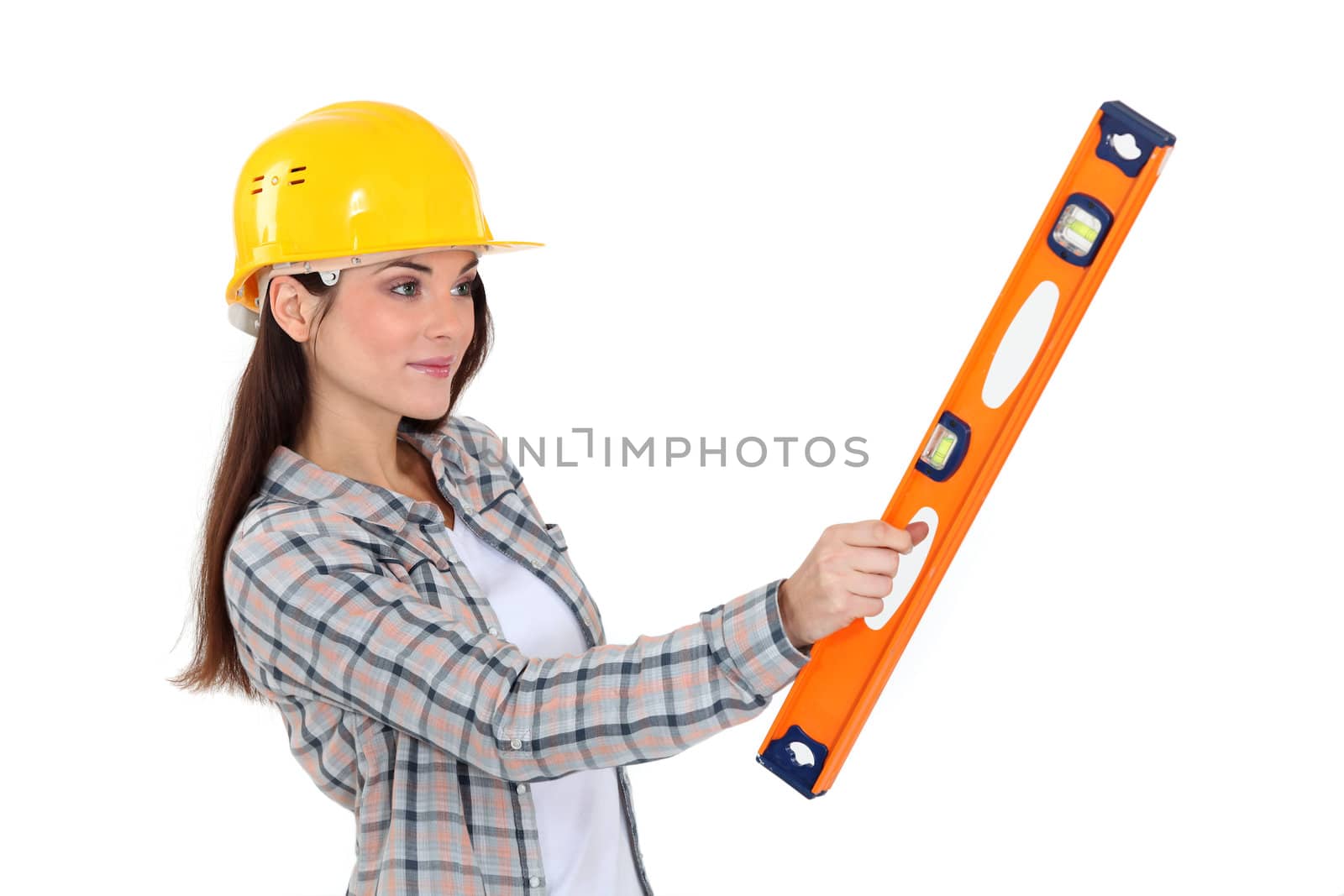 Worker holding a spirit level. by phovoir