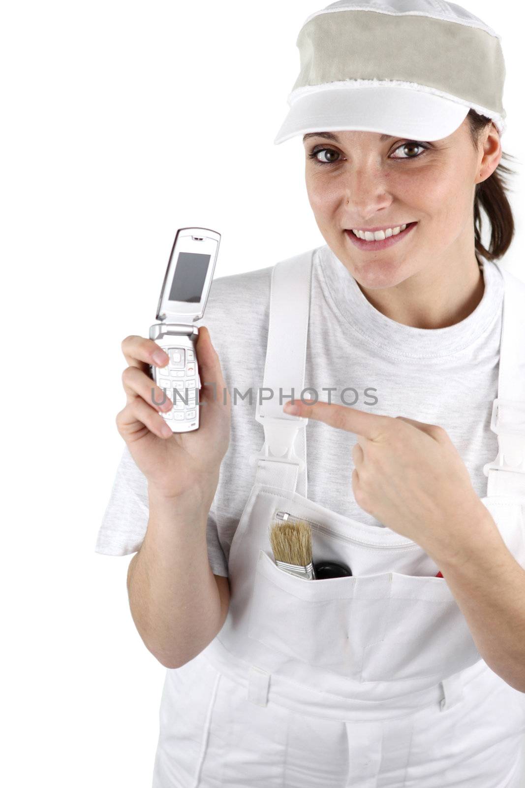 Female decorator waiting for the phone to ring