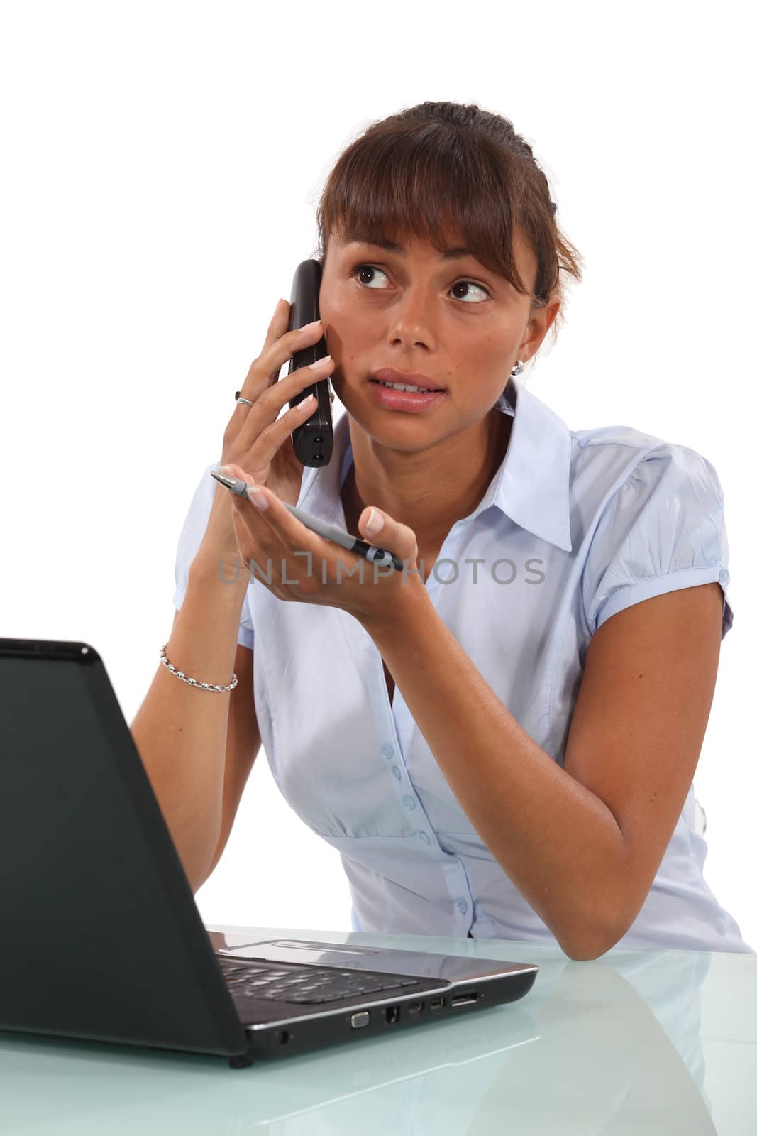 Brunette office worker at her desk