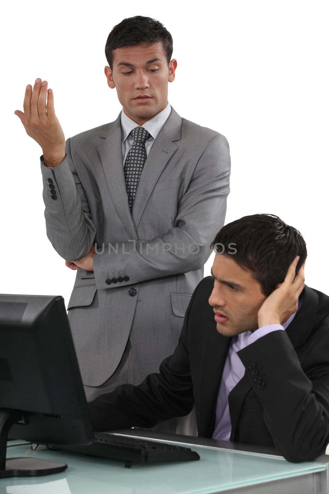 Businessmen having a difficult conversation by phovoir