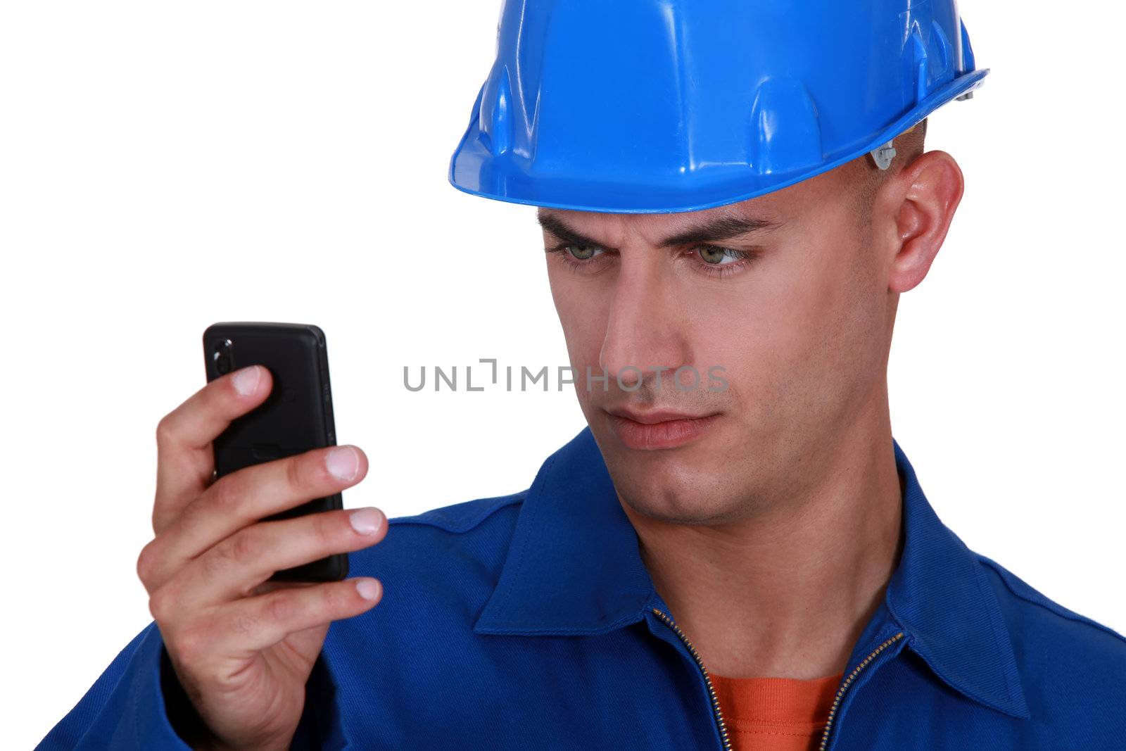 portrait of young blue collar reading sms against white background