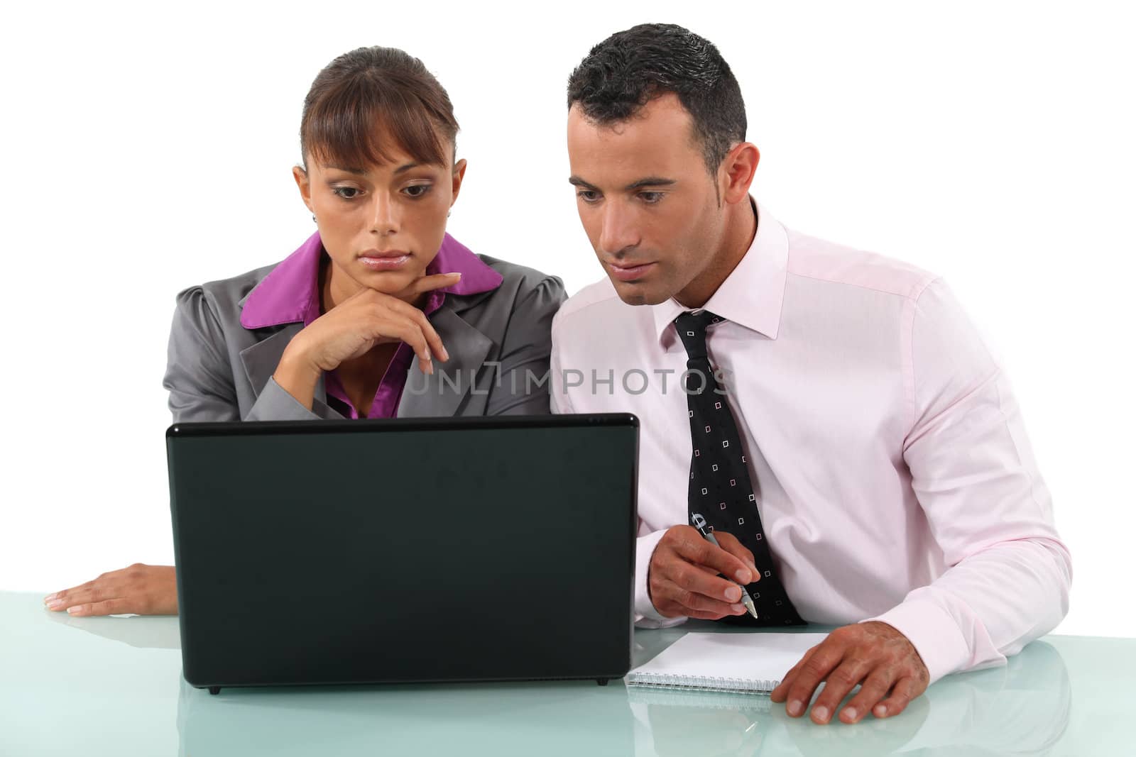 Two colleagues sat with laptop by phovoir