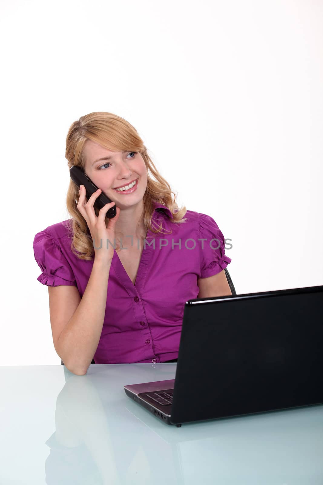 Smiling employee on the phone