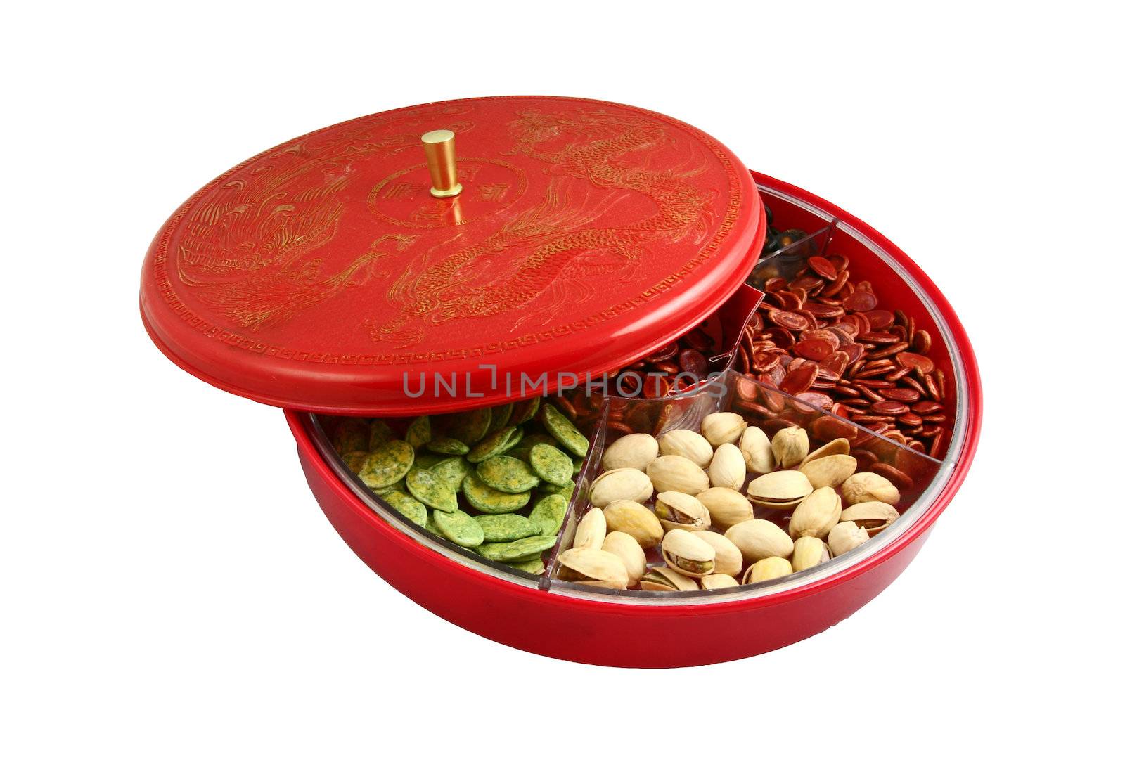 A top view of Chinese candy box. It is used for Chinese New Year, it consists different kinds of candies, chocolate coins, melon seeds, sugar preserved dried fruits or even dried vegetables.